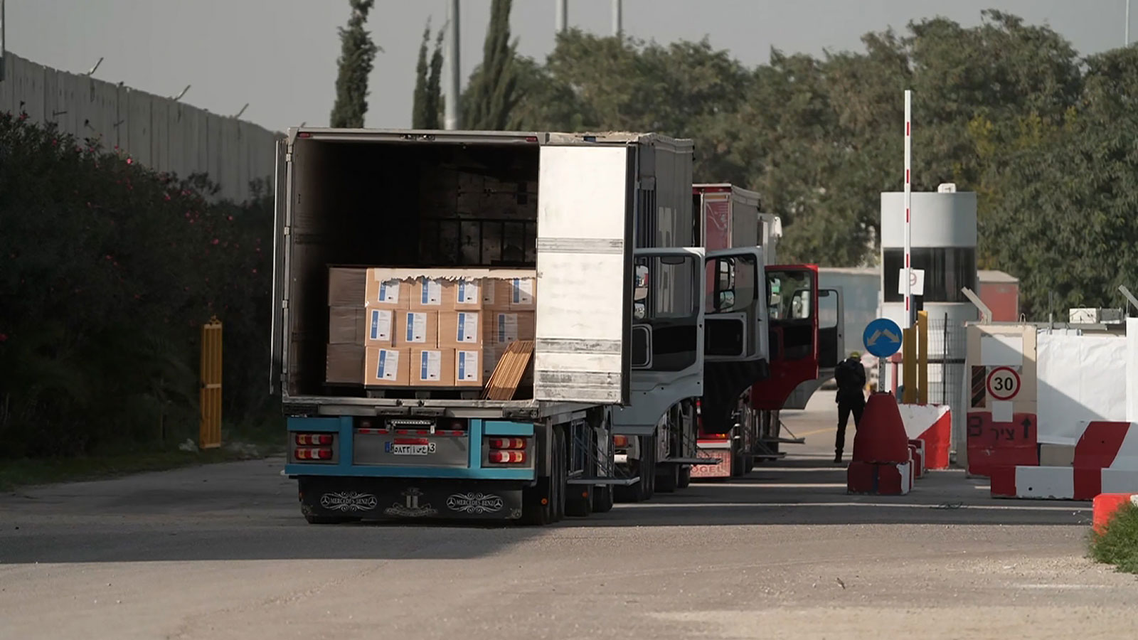Trucks are seen at Kerem Shalom on Tuesday, December 12.