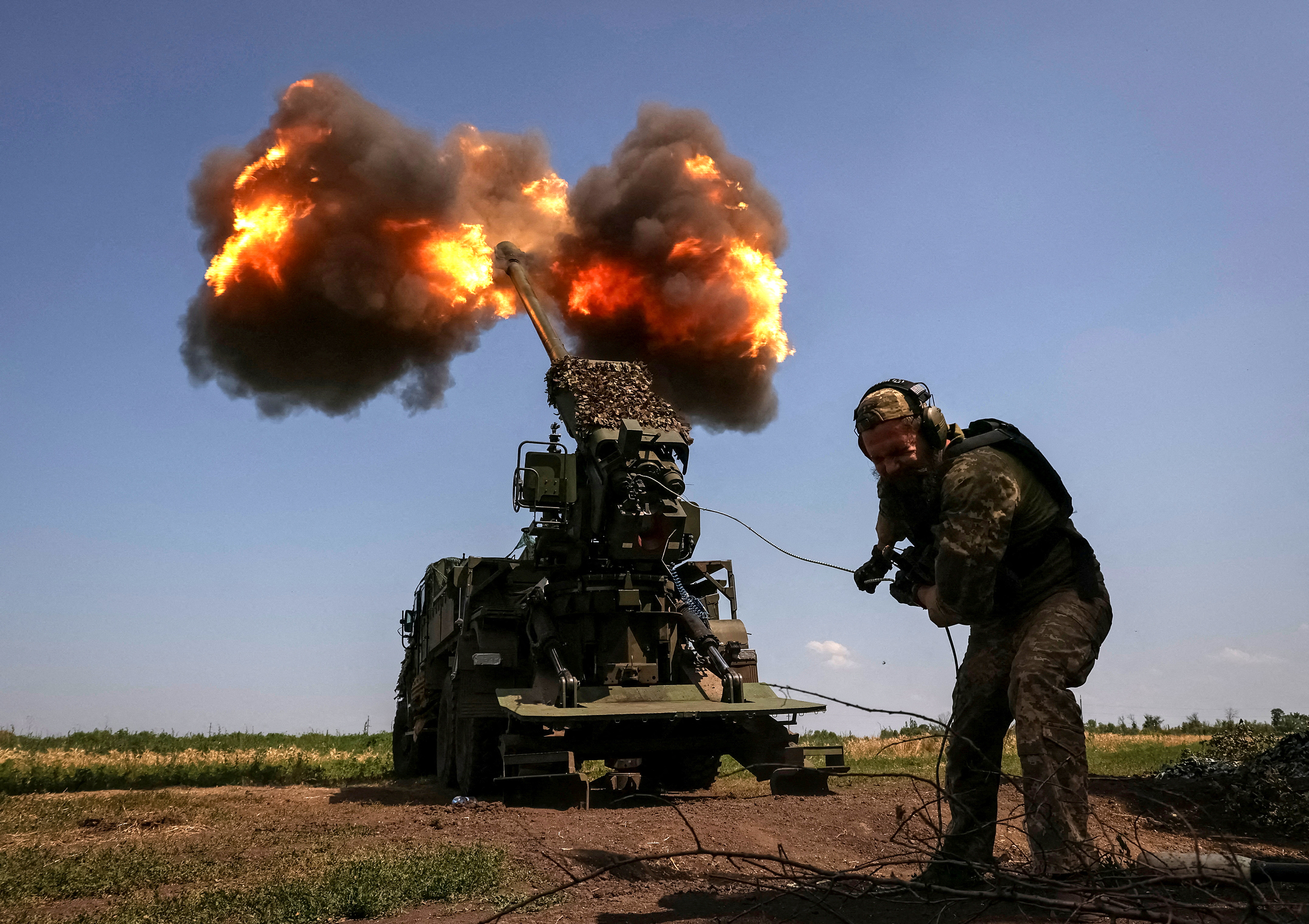 A Ukrainian serviceman fires a self-propelled howitzer towards Russian troops near Bakhmut, Ukraine, on July 5. 