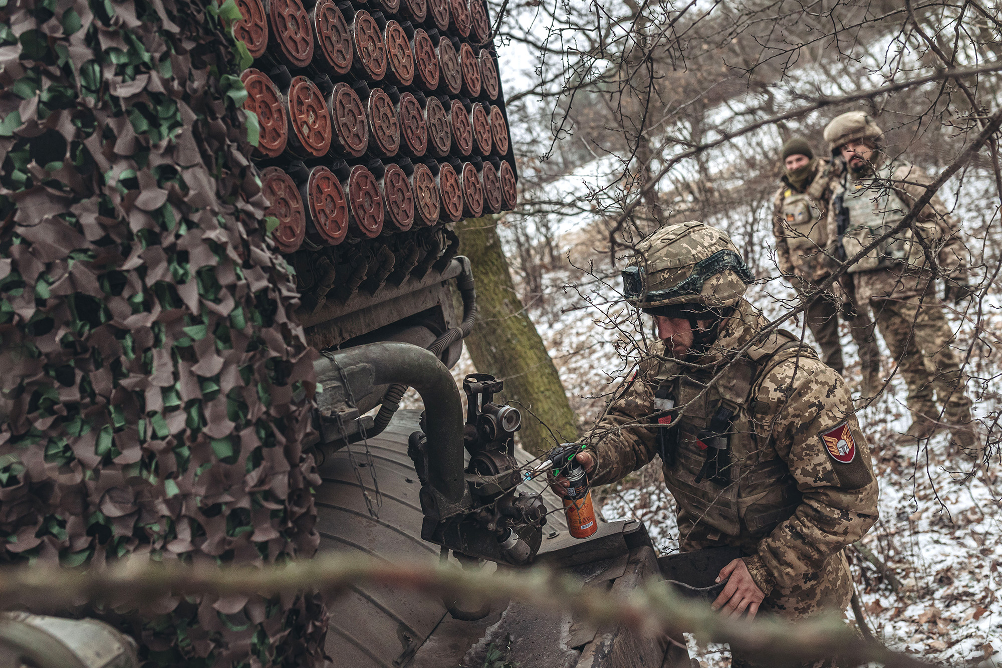 Ukrainian soldiers are seen next to a Grad missile vehicle near Soledar, in Donetsk Oblast, Ukraine, on January 13.