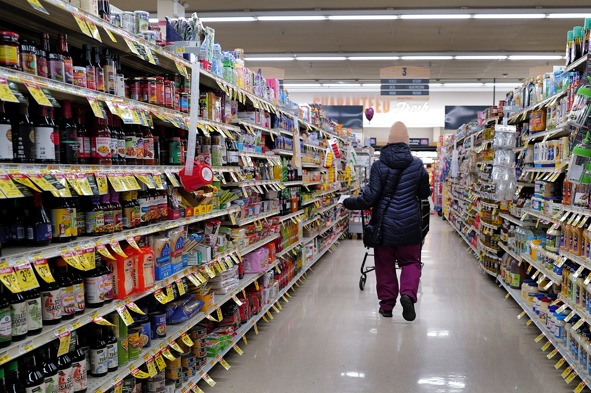 A customer shops at a grocery store on February 13 in Chicago, Illinois. 