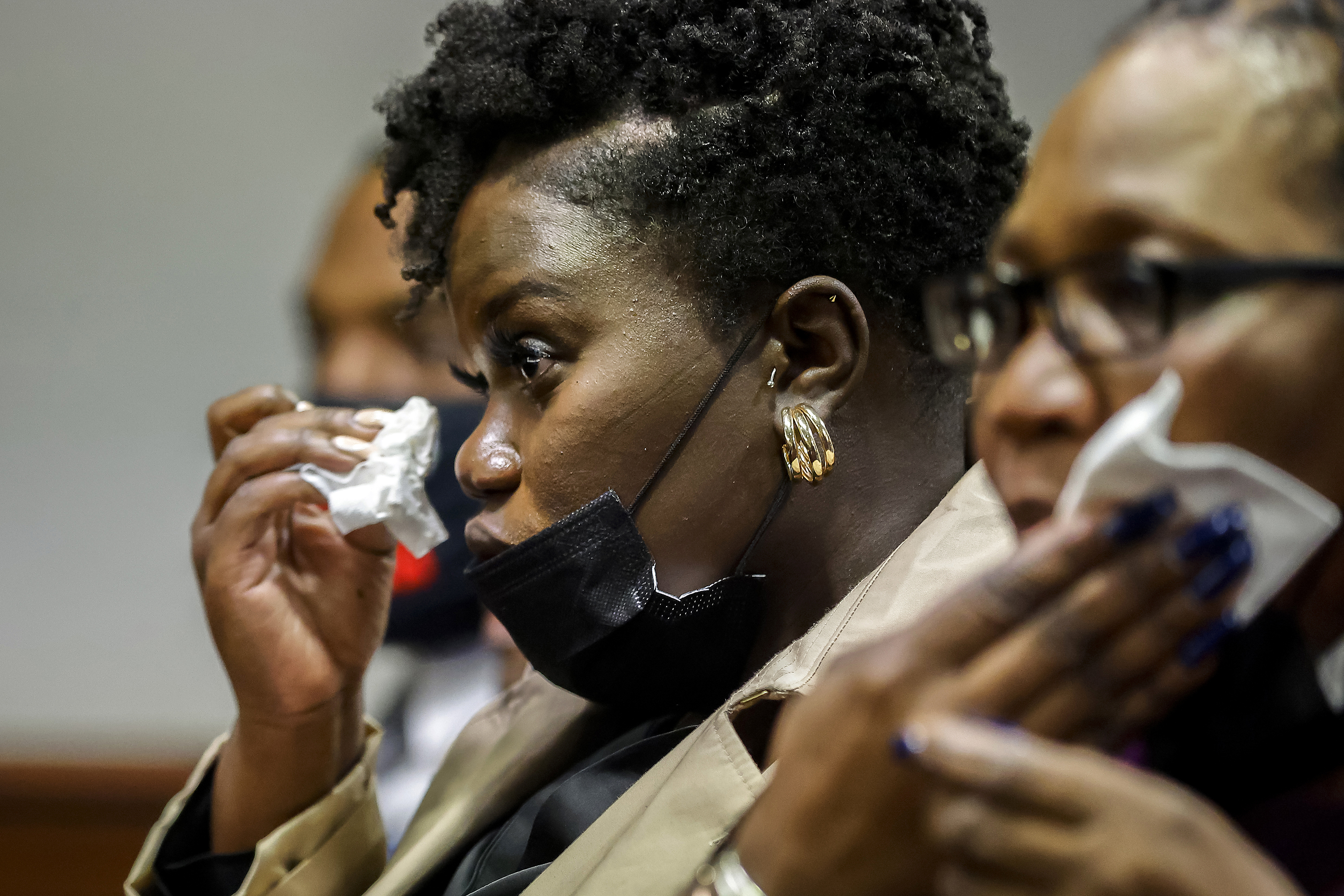 Ahmaud Arbery's sister Jasmine Arbery wipes a tear from her eyes in the Glynn County Courthouse, on January 7, 2022 in Brunswick, Georgia.