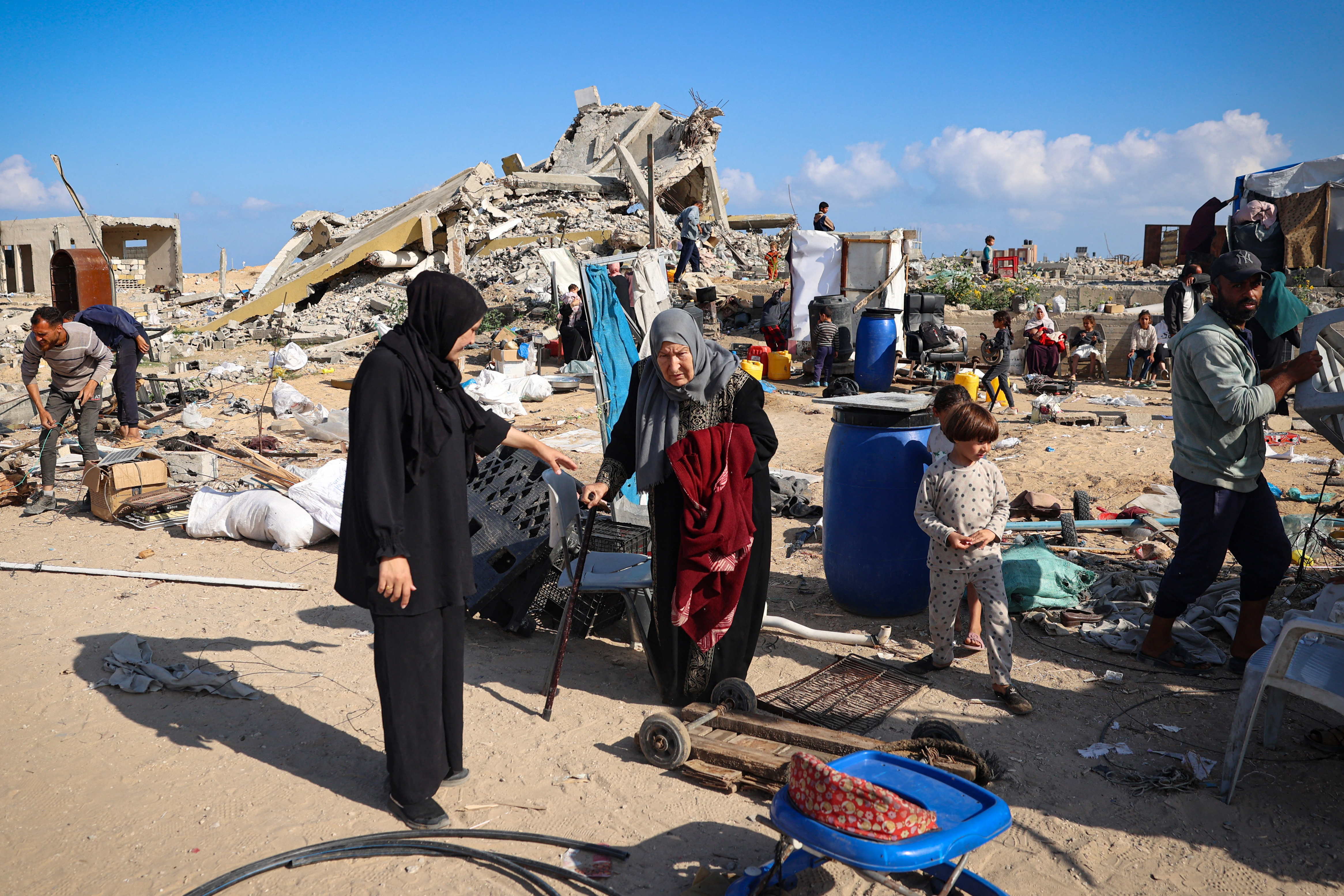 Displaced Palestinians pack their belongings before leaving Rafah, Gaza, on May 15.