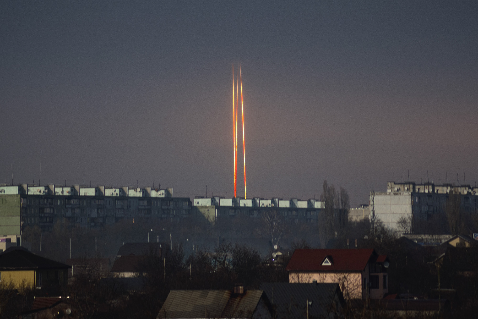 Three Russian rockets launched From Russia's Belgorod region are seen at dawn in Kharkiv, Ukraine, on March 9.