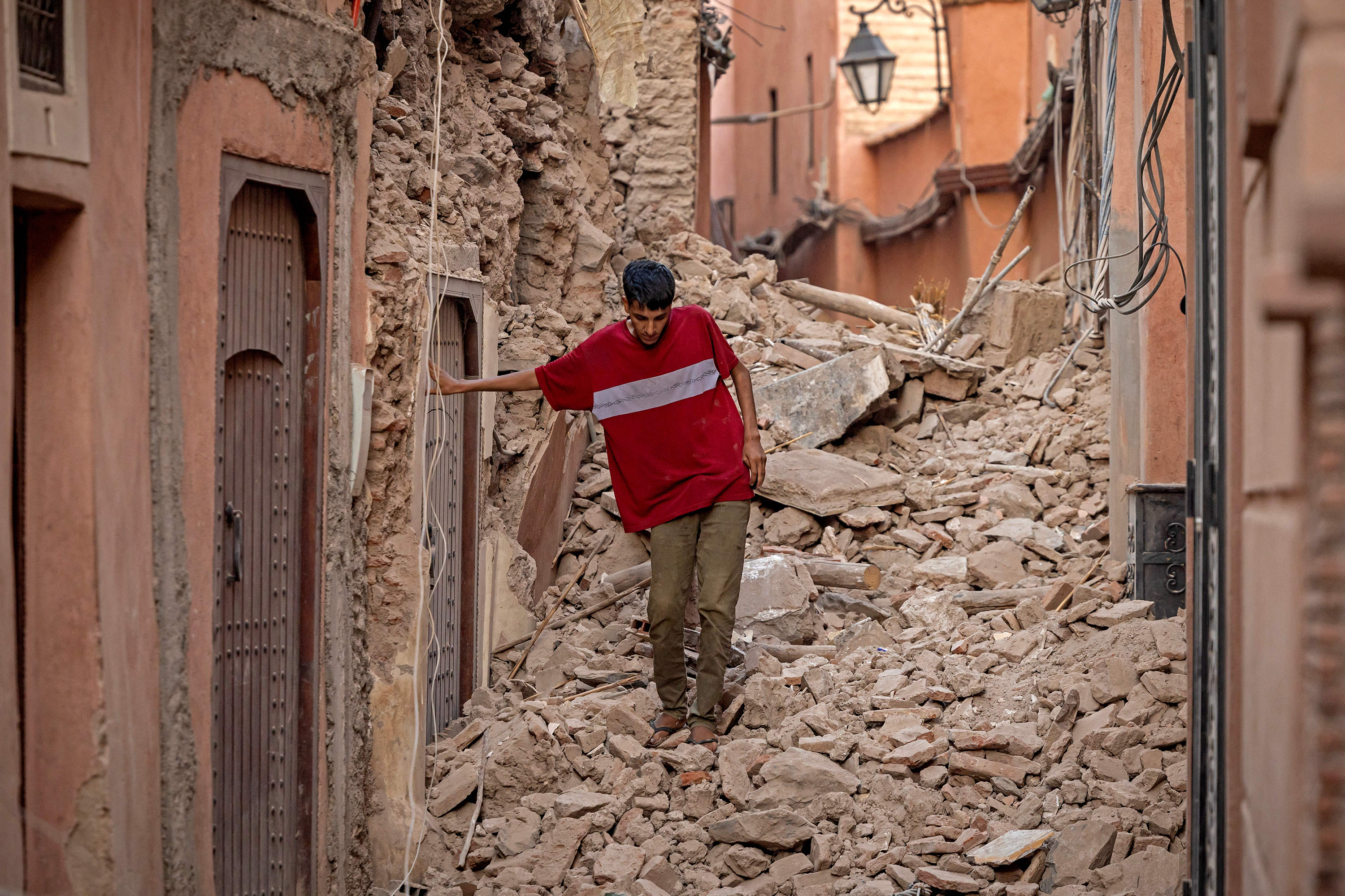 A resident navigates through the rubble in Marrakech, Morocco, on Saturday, September 9. 