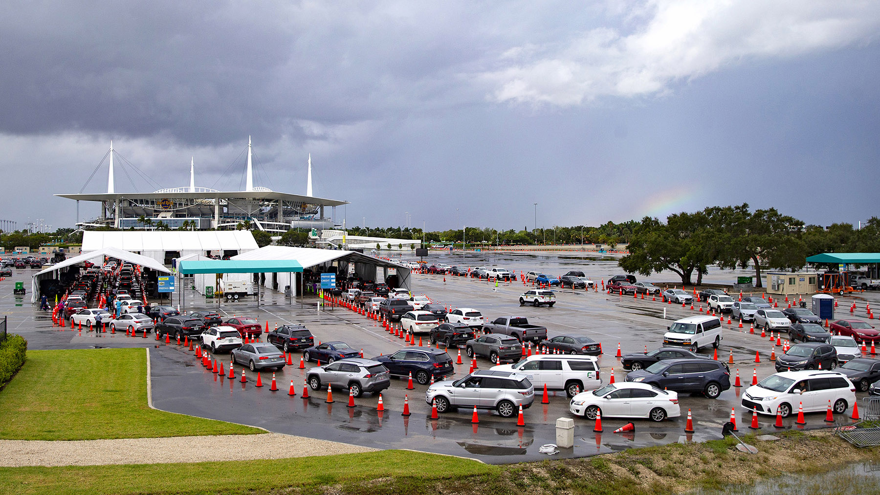 Vehicles line up at the COVID-19 drive-thru testing center at the Hard Rock Stadium in Miami Gardens, Florida, on Sunday, November 22. 