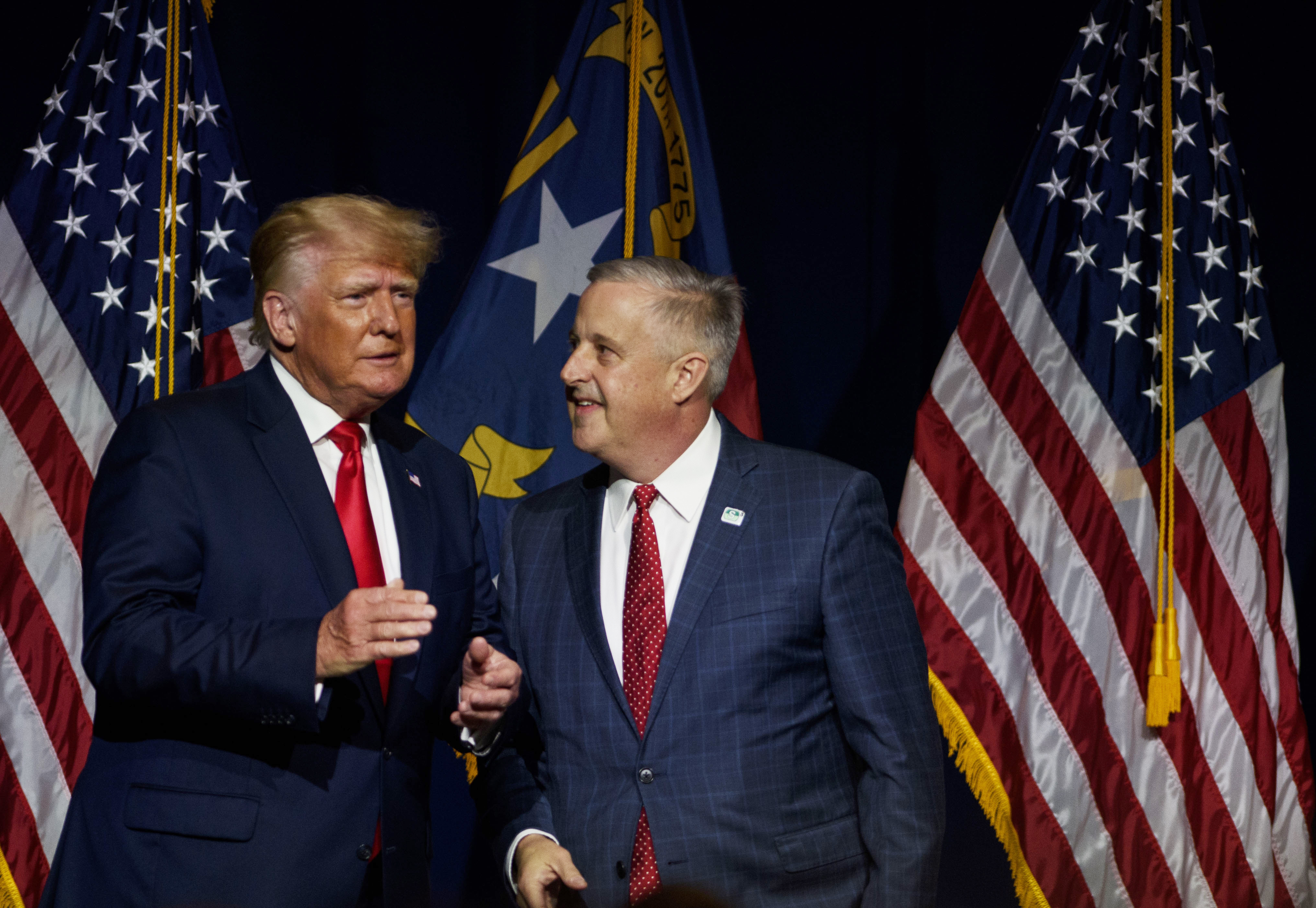 Former President Donald Trump takes the stage with NCGOP Chairman Michael Whatley after being announced at the NCGOP state convention on June 5, 2021 in Greenville, North Carolina. 