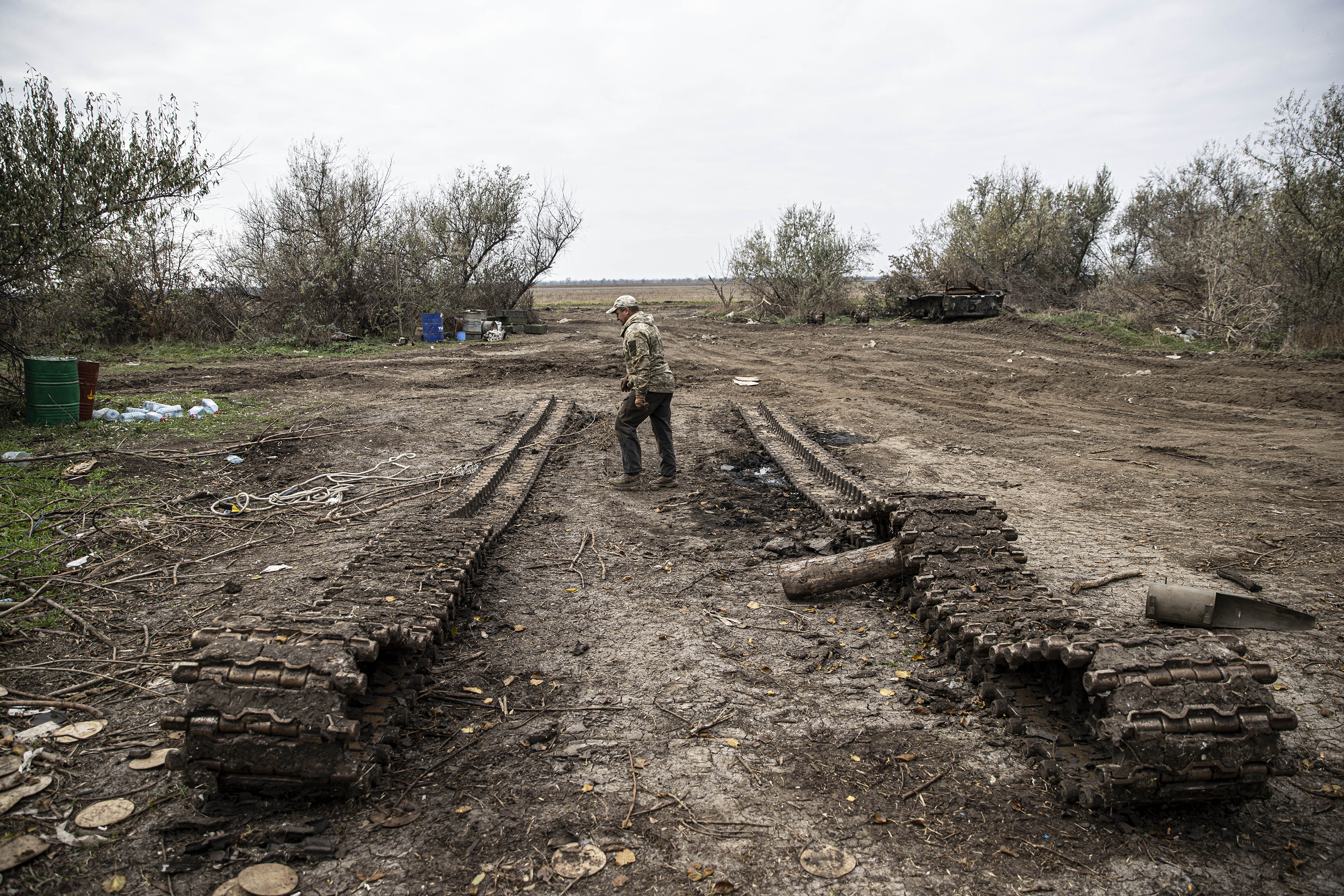 Russian tank tracks and a Ukrainian soldier are seen in Kherson, Ukraine on November 9, 