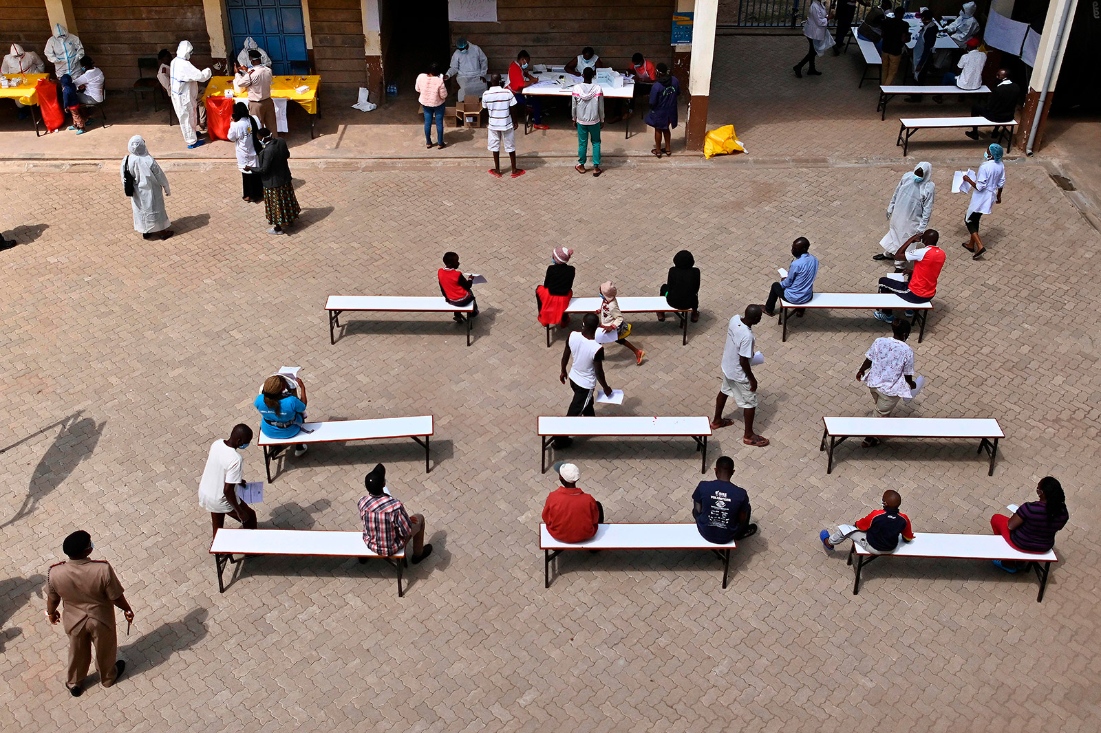People wait to be tested for coronavirus on May 28 in Ruaraka, Kenya.