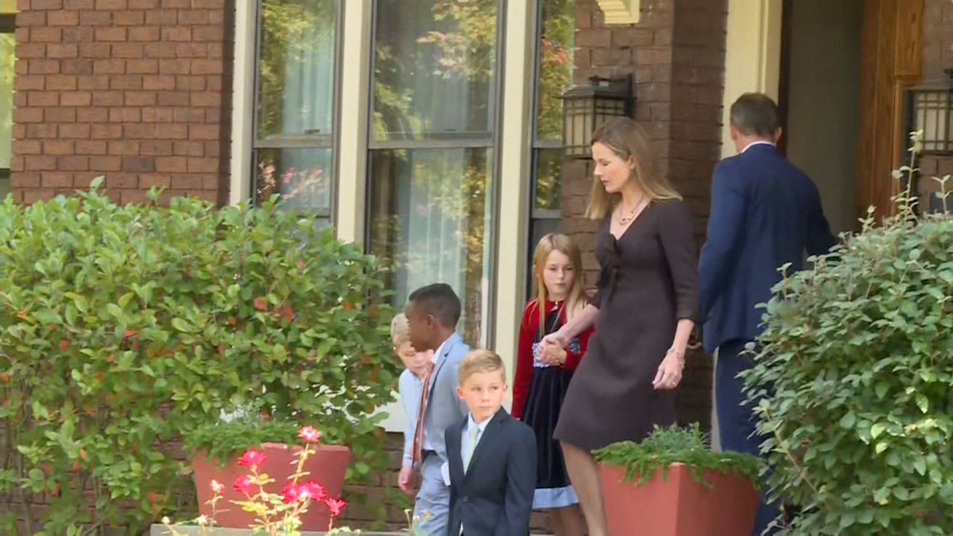 Judge Amy Coney Barrett and her family are seen leaving their South Bend, Indiana home on Saturday, September 26.