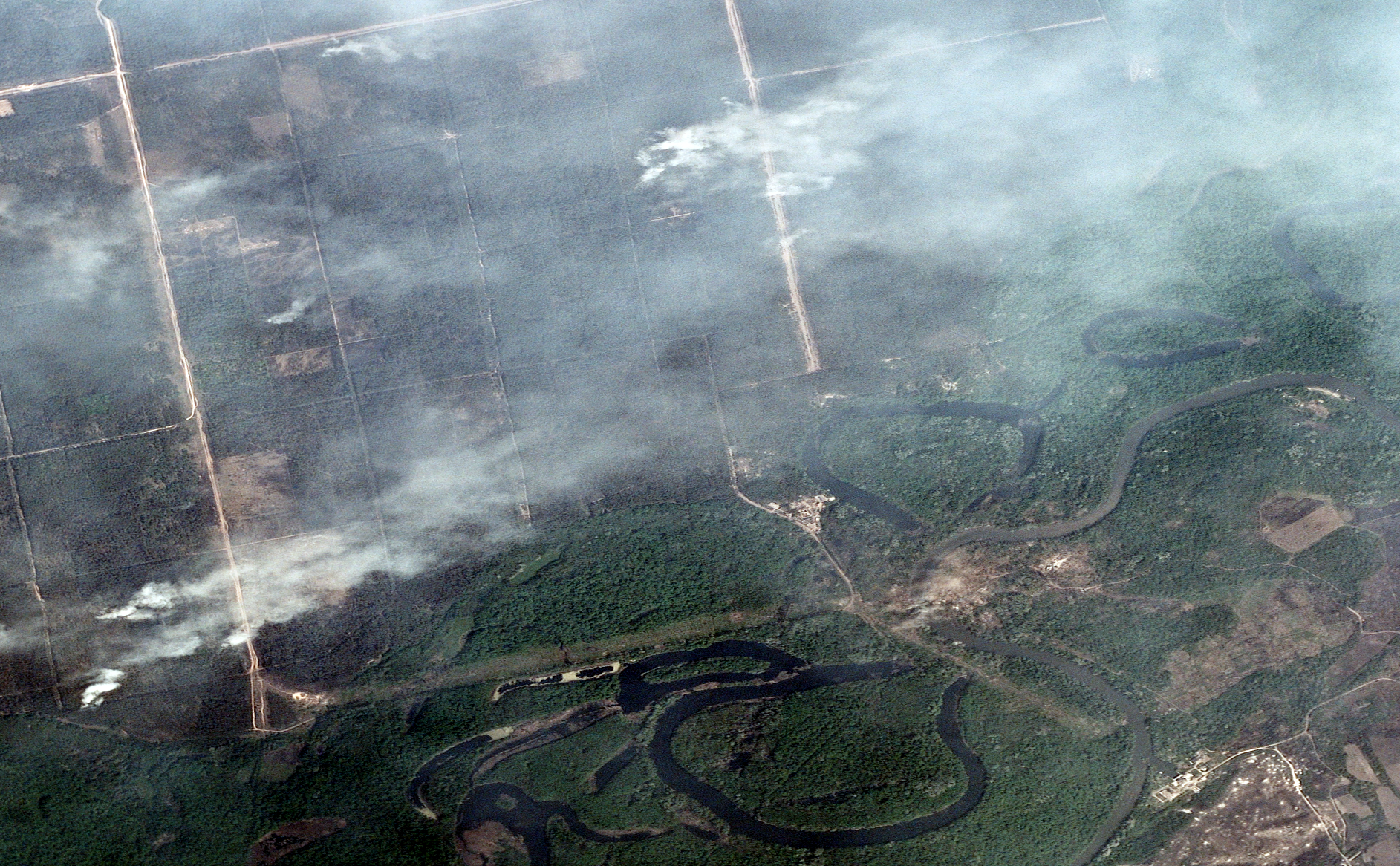 This satellite image shows large plumes of smoke rising above the Siverskyi Donets river on May 12 near Bilohorivka, Ukraine. 