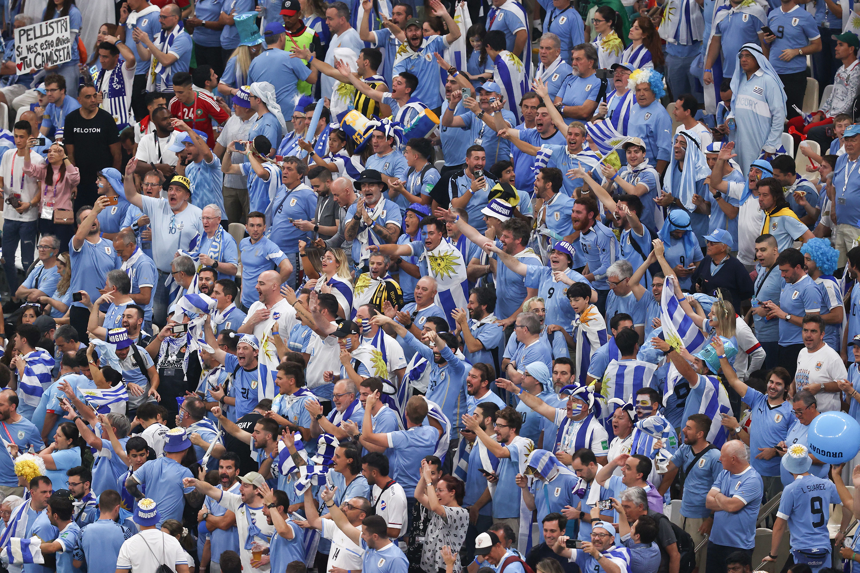 Fans of Uruguay are seen ahead of the match on Monday.