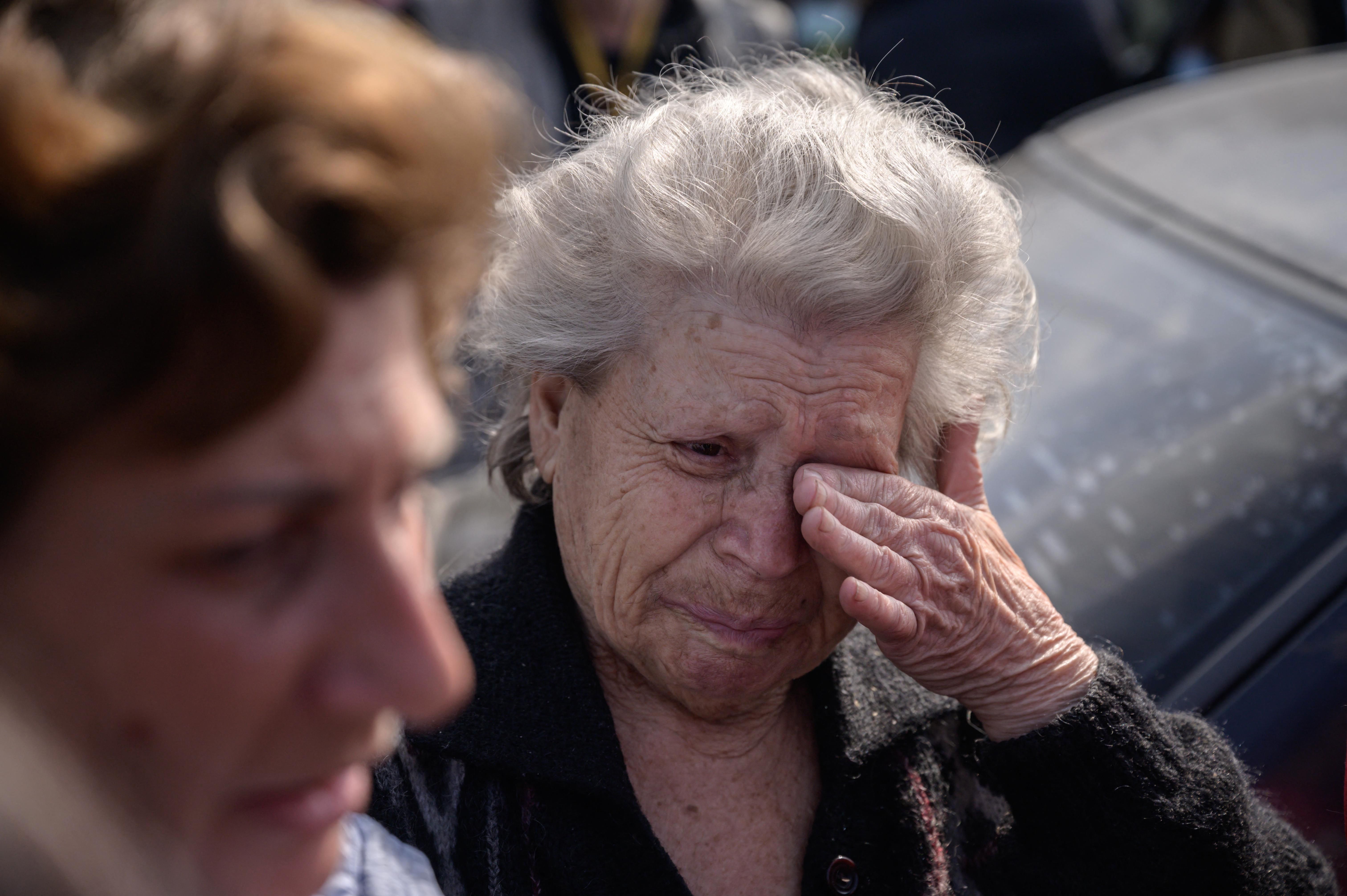 Mother and daughter Dina, right, and Natasha, left, from Mariupol, arrived in their own vehicle separate from a larger convoy expected later, at a registration and processing area for internally displaced people arriving from Russian-occupied territories in Ukraine, in Zaporizhzhia, on May 2.