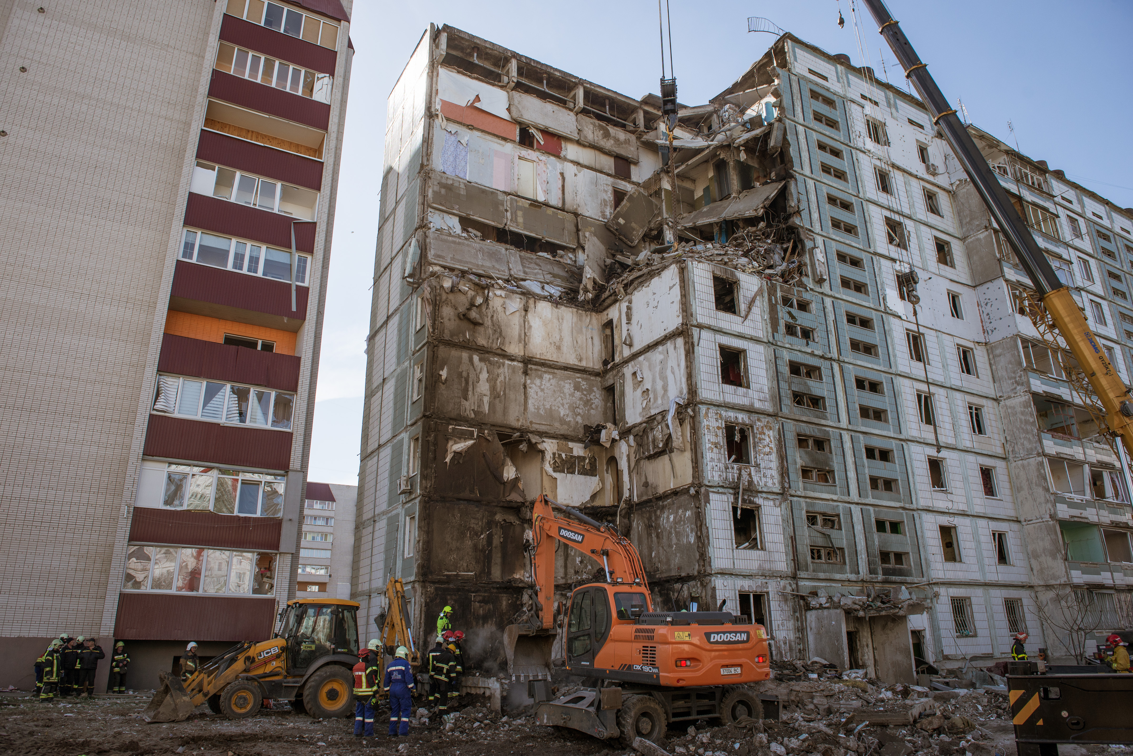 Firefighters and search and rescue teams conduct operation after Russian rocket hit residential building in Uman district located in Cherkasy Oblast, Ukraine, on April 28