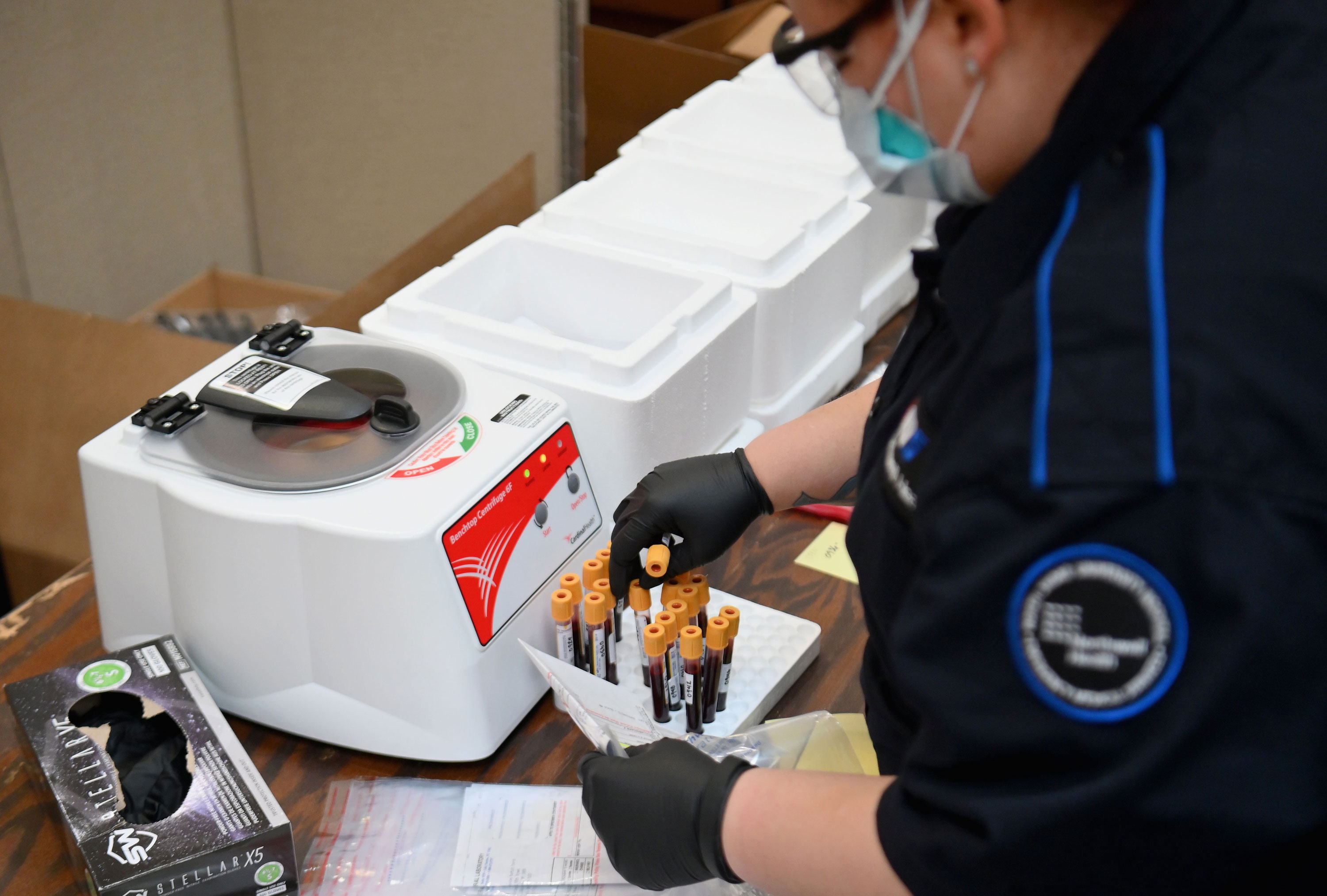An Emergency medical Technician sorts through blood samples to test for COVID-19 antibodies at Abyssinian Baptist Church in the Harlem neighborhood of New York on May 14.
