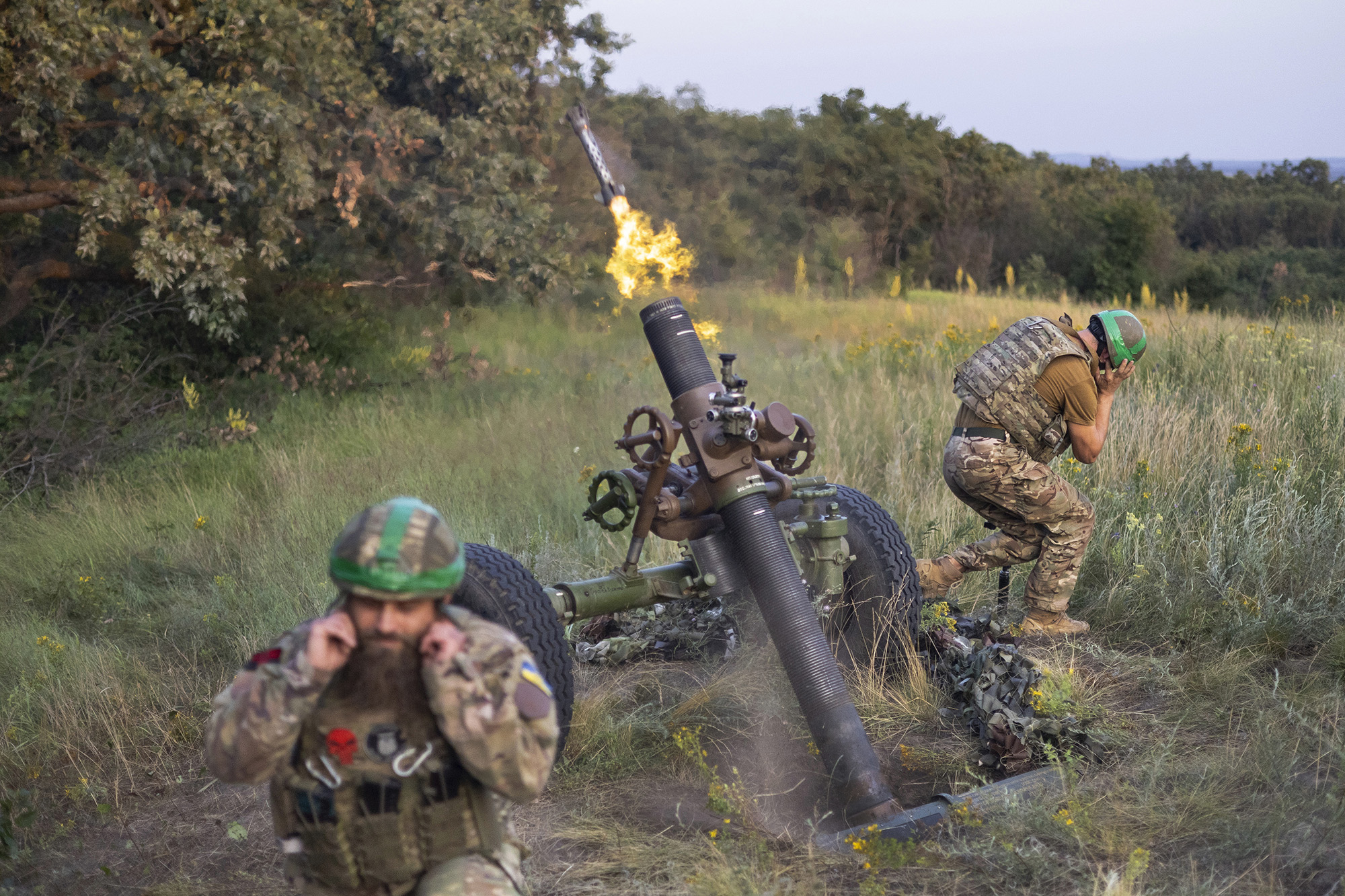 Ukrainian servicemen of the 3rd Assault Brigade fire a 122mm mortar towards Russian positions at the front line in Donetsk region, Ukraine, on July 2.