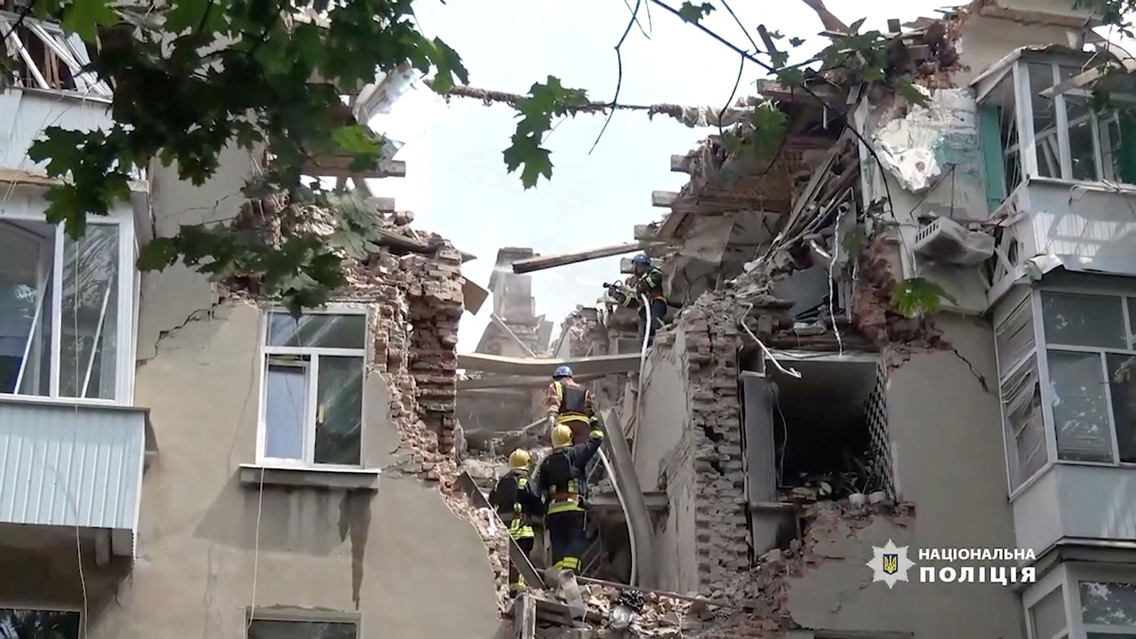 A frame from a video shows rescue workers at a damaged building after a drone strike, in Sumy, Ukraine, on July 3.