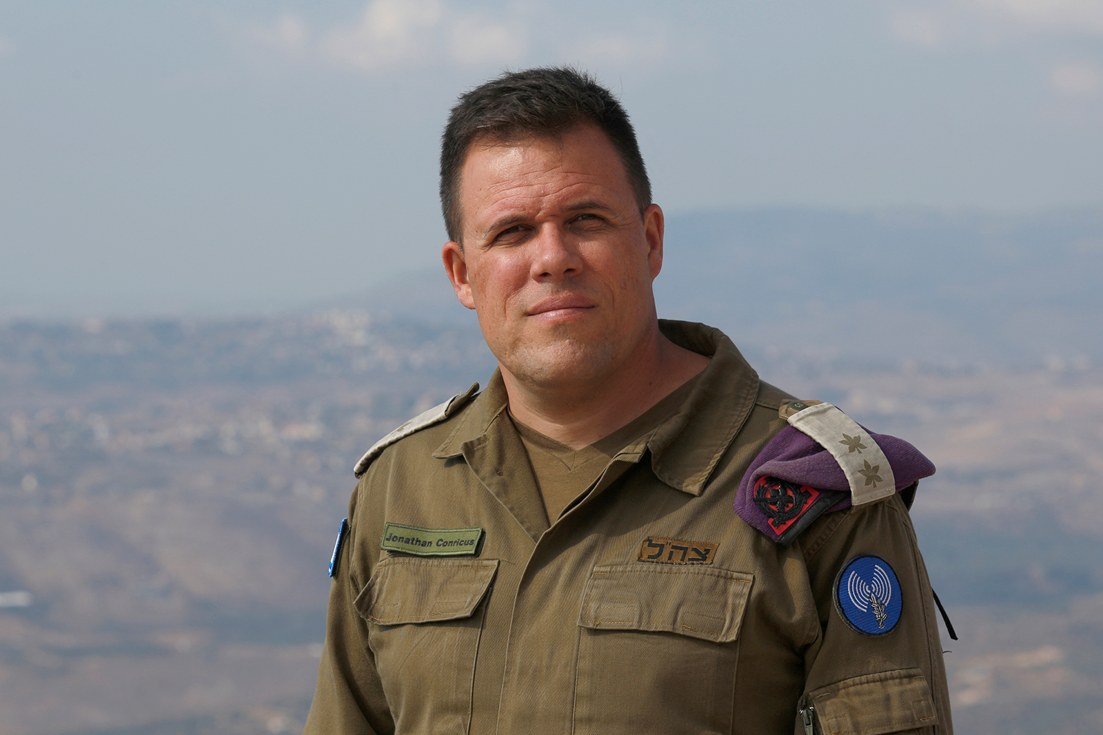 Lt. Col. Jonathan Conricus poses for a picture in the military base of Har Dov on Mount Hermon, a strategic and fortified outpost at the crossroads between Israel, Lebanon and Syria on October 30, 2019. 