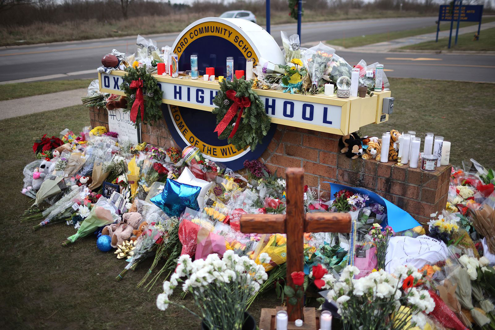 Flowers are placed at a memorial outside of Oxford High School on December 3, 2021, in Oxford, Michigan. 