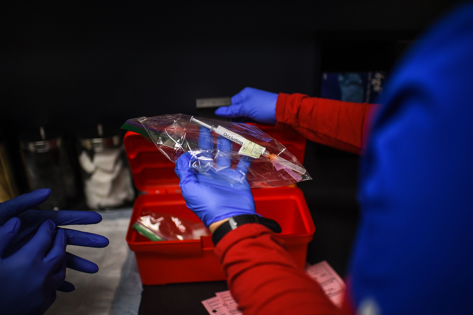A medic holds a Pfizer-BioNtech Covid-19 vaccine at the Research Centers of America in Hollywood, Florida on December 18.