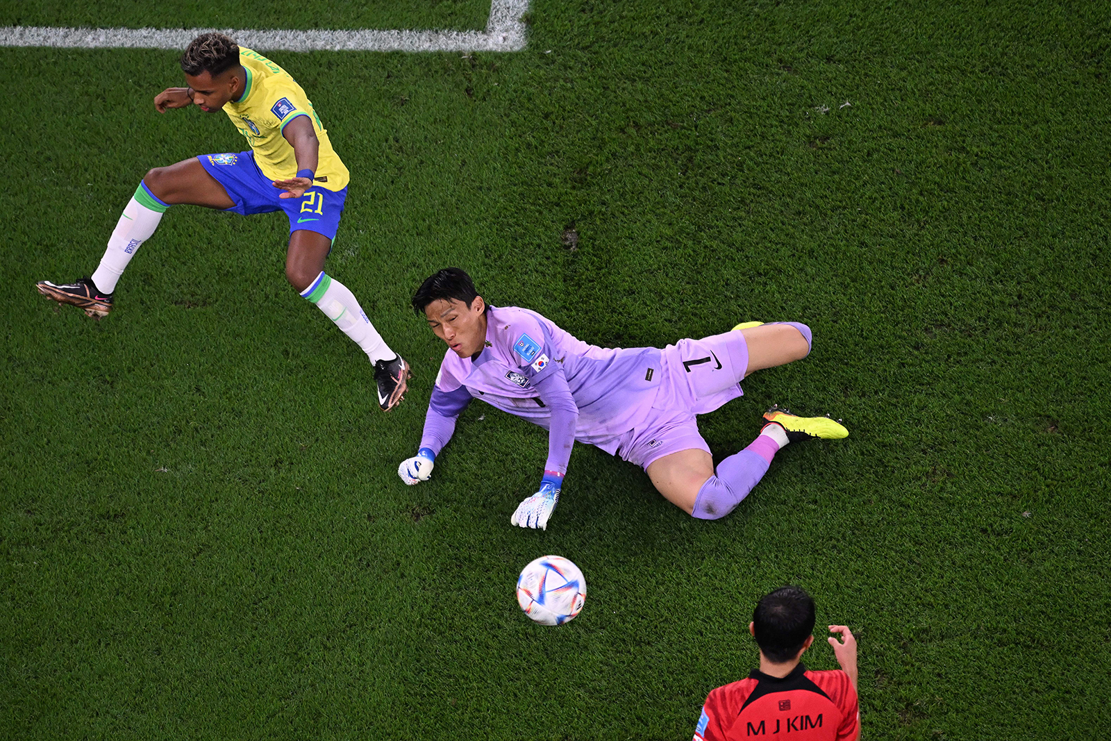 South Korea's goalkeeper Kim Seung-gyu makes a save during the match.