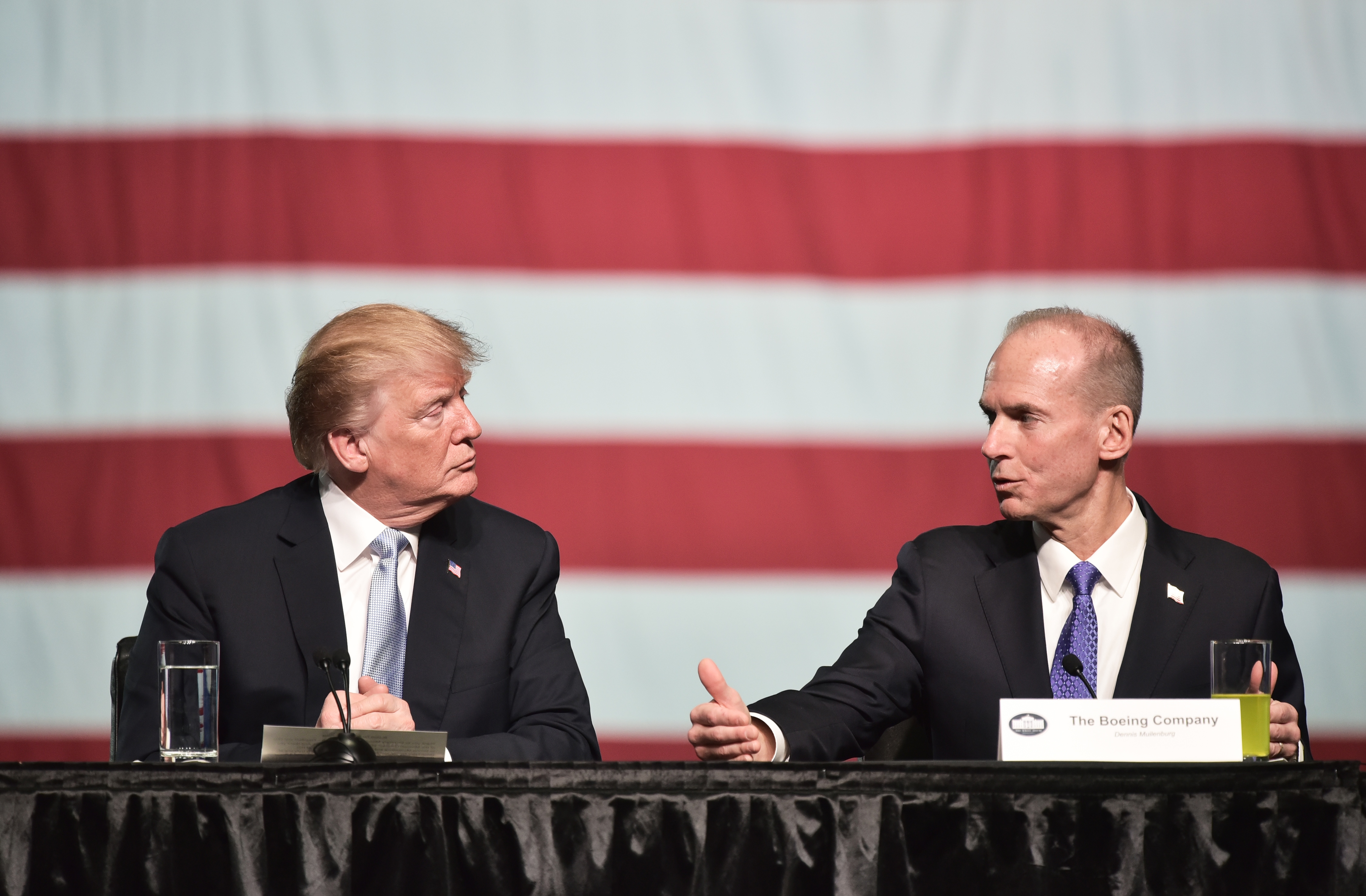 Boeing CEO Dennis Muilenburg speaks during a round table discussion with President Donald Trump following a tour of the Boeing Company in St. Louis, Missouri on March 14, 2018.