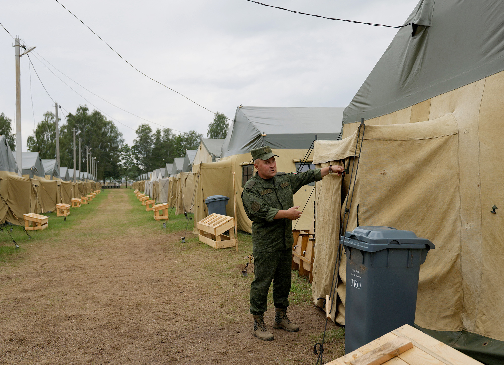 Major General Leonid Kasinsky shows a tent camp near the village of Tsel in the Asipovichy District, Belarus, on July 7.