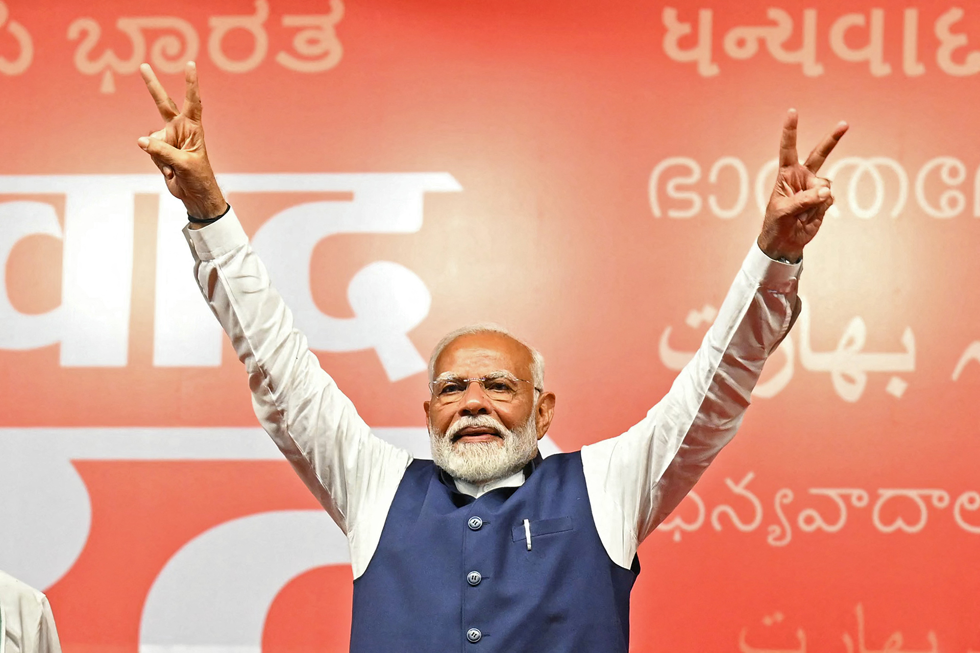 India's Prime Minister Narendra Modi flashes victory sign at the Bharatiya Janata Party (BJP) headquarters to celebrate the party's win in country's general election, in New Delhi, India, on June 4.