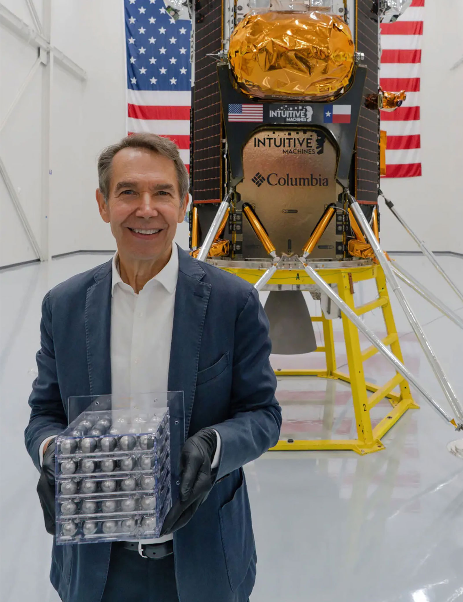 Jeff Koons holds "Moon Phases" before it was attached to the lunar lander. 