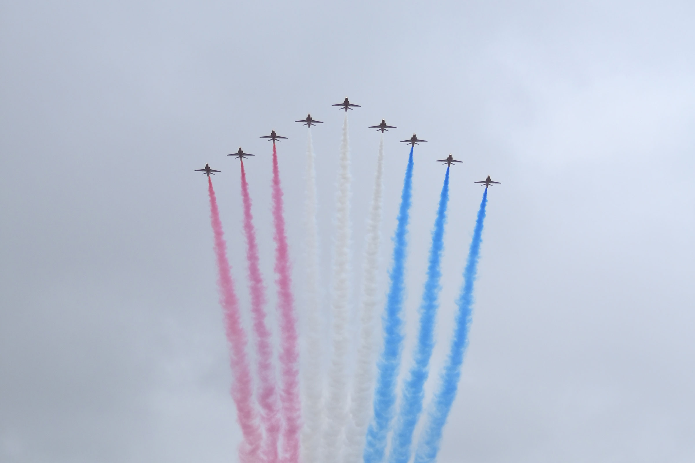 The Royal Air Force Aerobatic Team otherwise known as The Red Arrows fly over The Mall during the Coronation of King Charles III and Queen Camilla.
