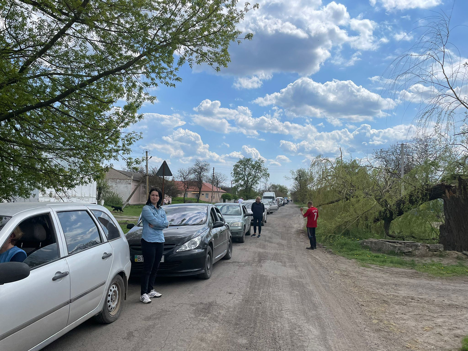 A long convoy of vehicles attempt to drive north toward the city of Kryvyi Rih, Ukraine on Sunday, May 1.