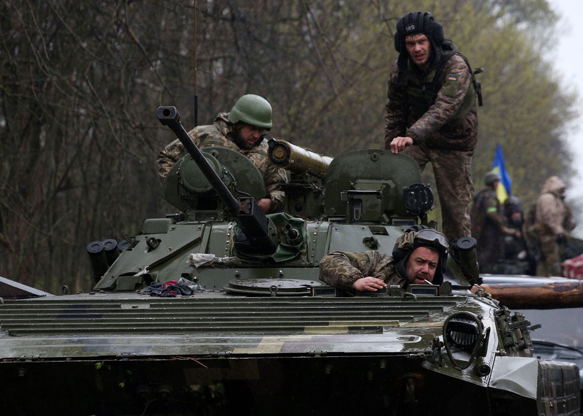 Ukrainian soldiers stand on their armoured personnel carrier (APC), not far from the front-line in the Izyum district of the Kharkiv region, Ukraine, on April 18.