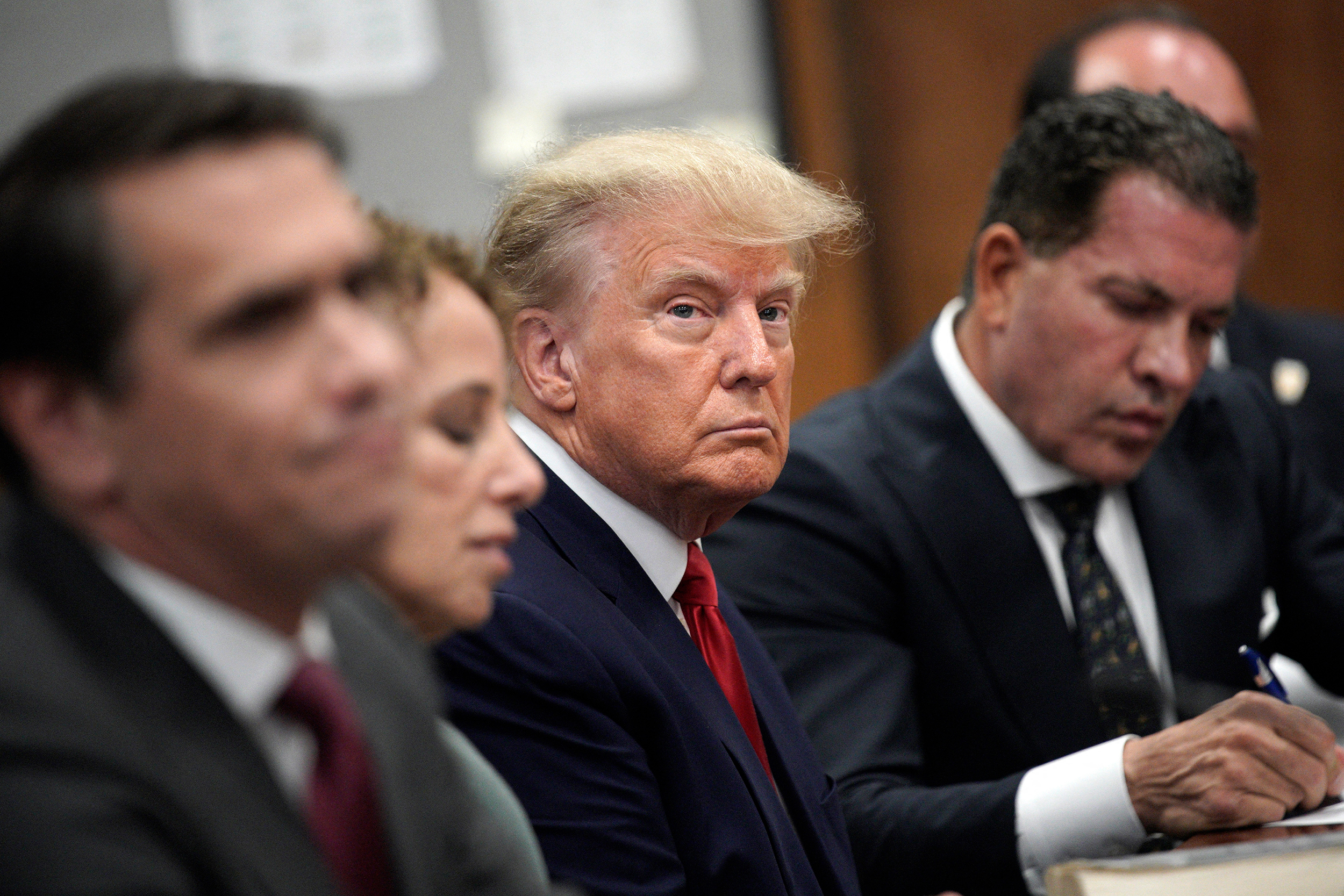 Former U.S. President Donald Trump appears in court with members of his legal team for an arraignment on charges stemming from his indictment by a Manhattan grand jury following a probe into hush money paid to porn star Stormy Daniels, in New York City on April 4, 2023.