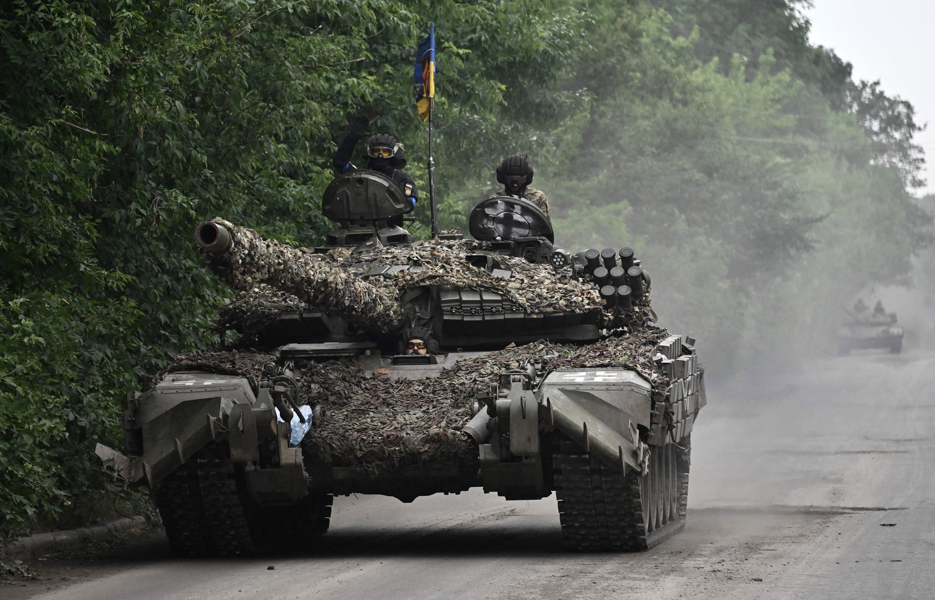 Ukrainian servicemen ride on a tank in Donetsk region on June 28. 