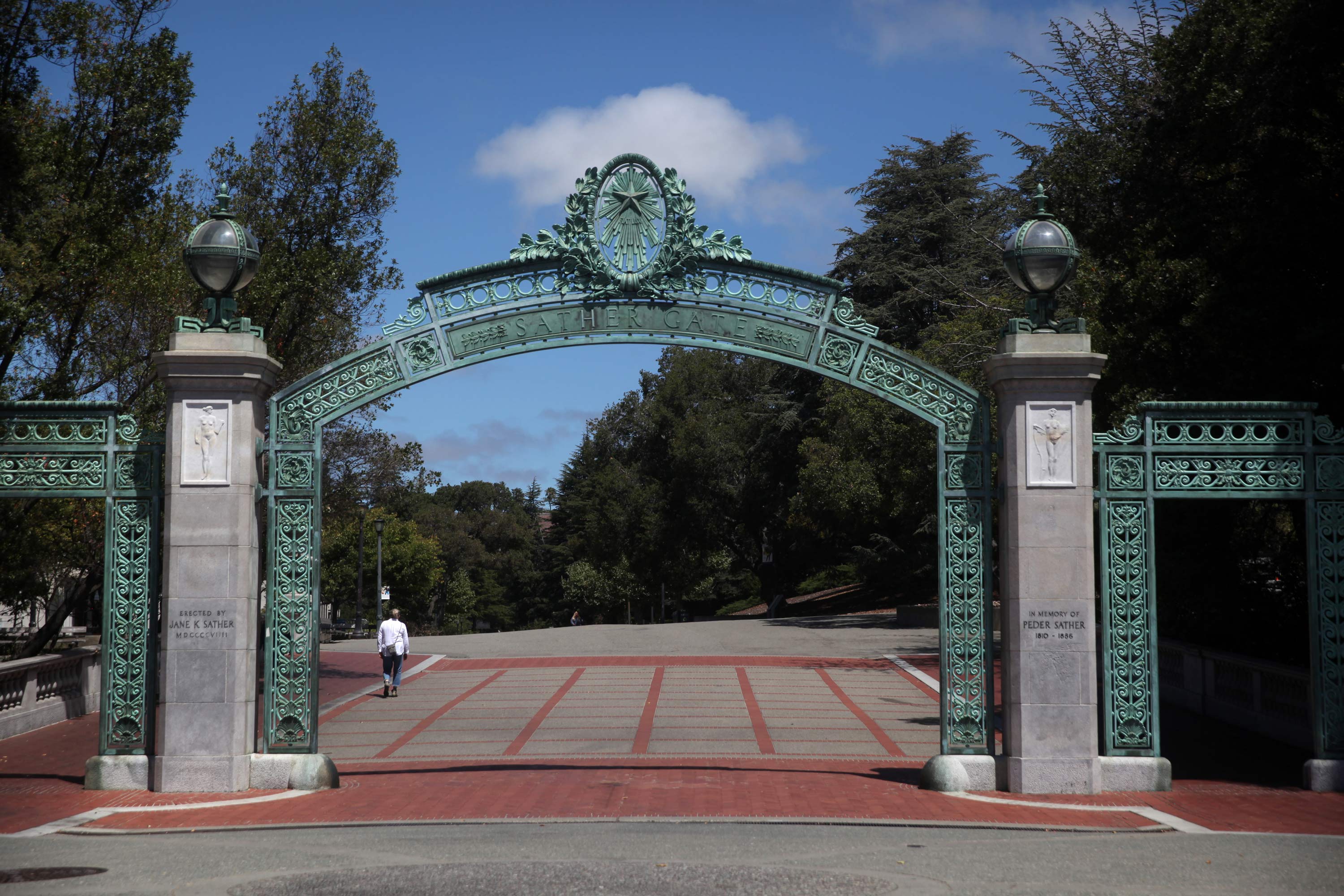 A lone pedestrian walks by Sather Gate on the U.C. Berkeley campus on July 22, 2020 in Berkeley, California. 