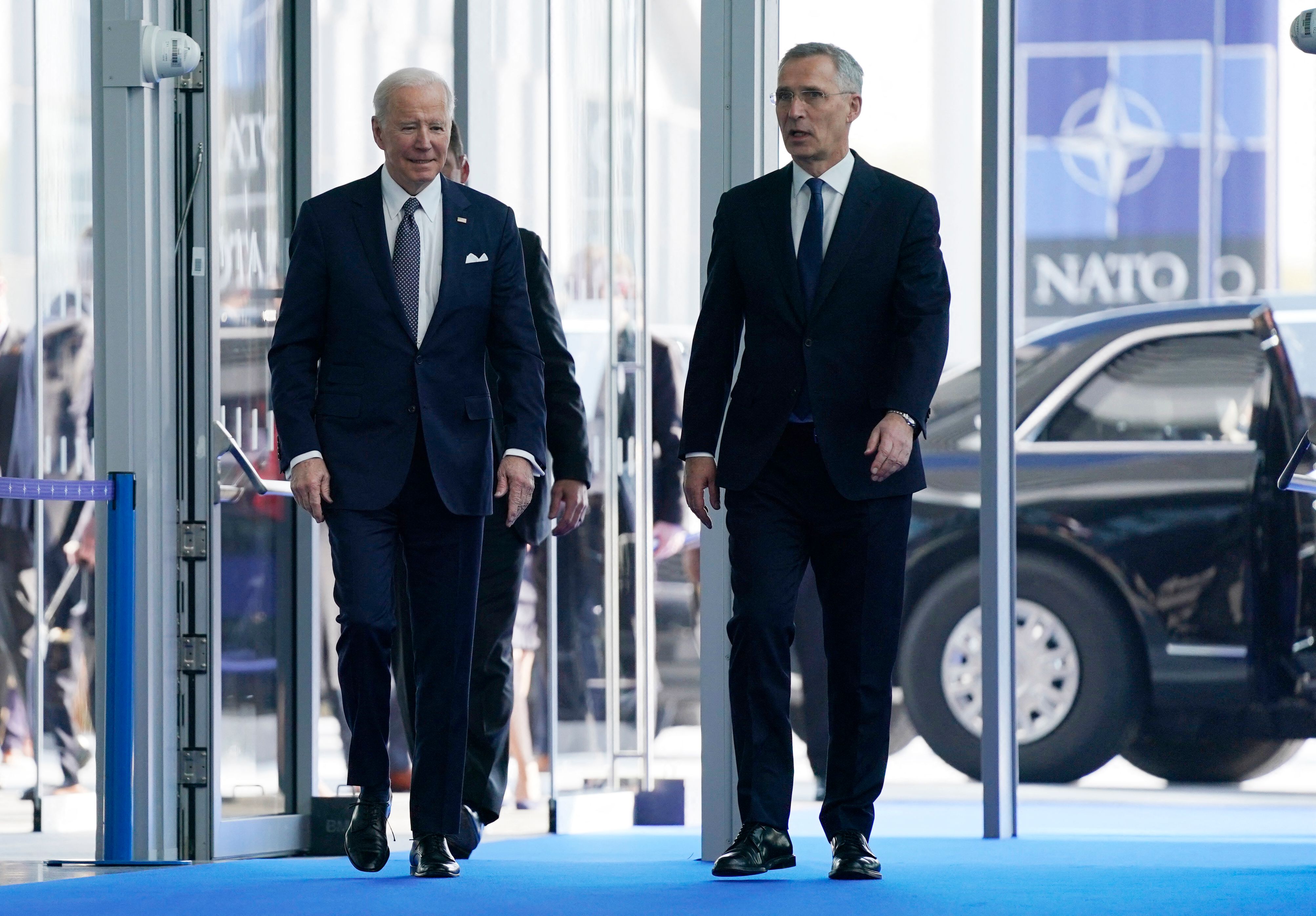 US President Joe Biden, left, walks with NATO Secretary General Jens Stoltenberg as he arrives for an extraordinary summit at NATO Headquarters in Brussels, Belgium, on March 24.