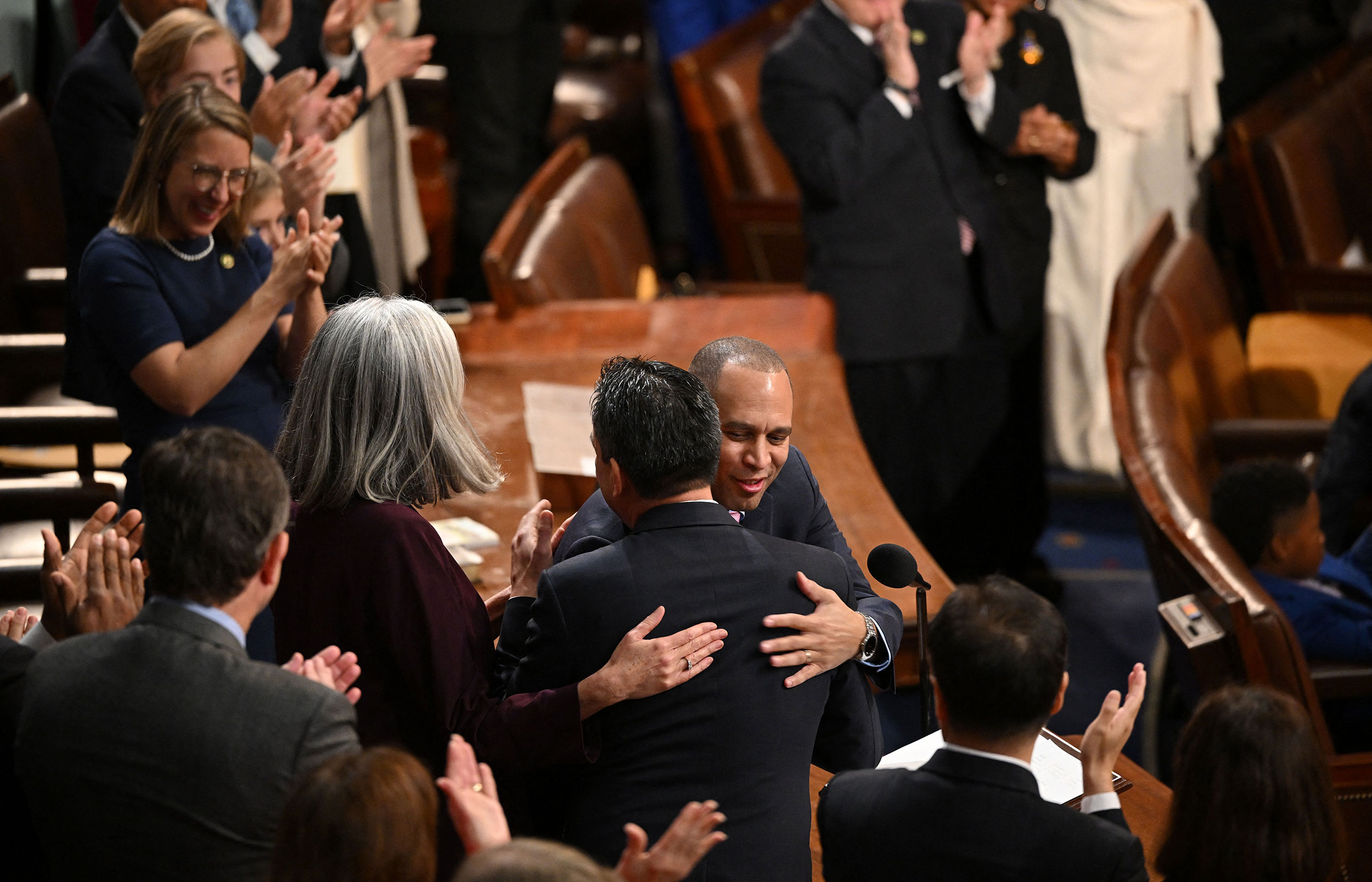 Democrat Hakeem Jeffries hugs US Rep. Pete Aguilar after being nominated for speaker.