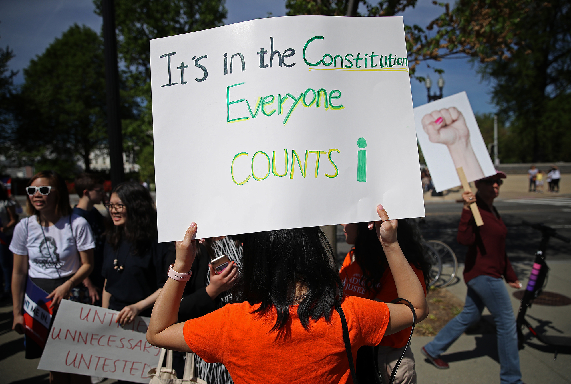 In this April 23, 2019 photo, protesters gather outside the U.S. Supreme Court as the court hears oral arguments in the Commerce vs. New York case in Washington, DC. The case highlights a question about U.S. citizenship included by the Trump administration in the proposed 2020 census.