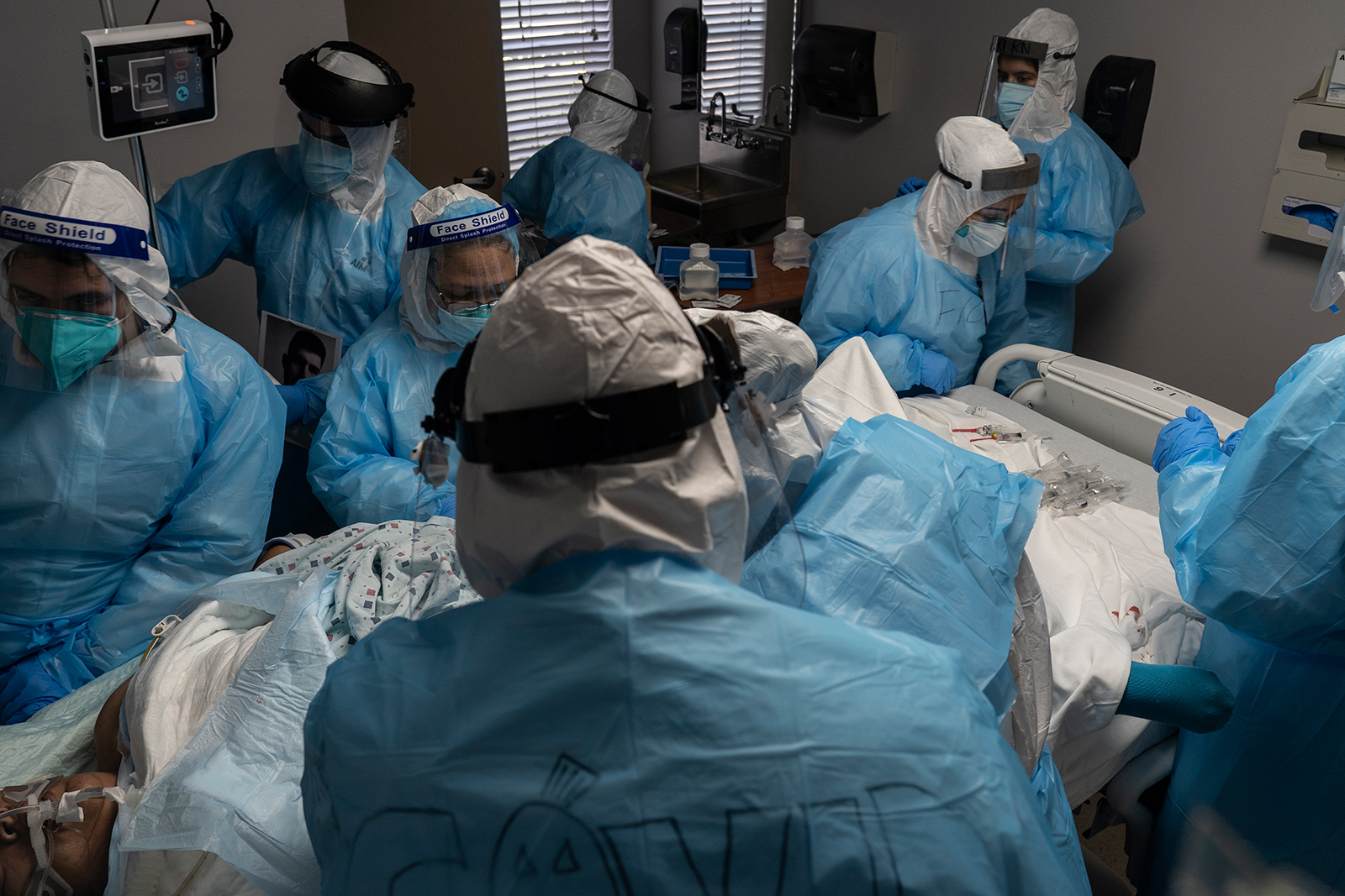 Medical staff members treat a patient suffering from Covid-19 at the United Memorial Medical Center (UMMC), in Houston, on October 31.