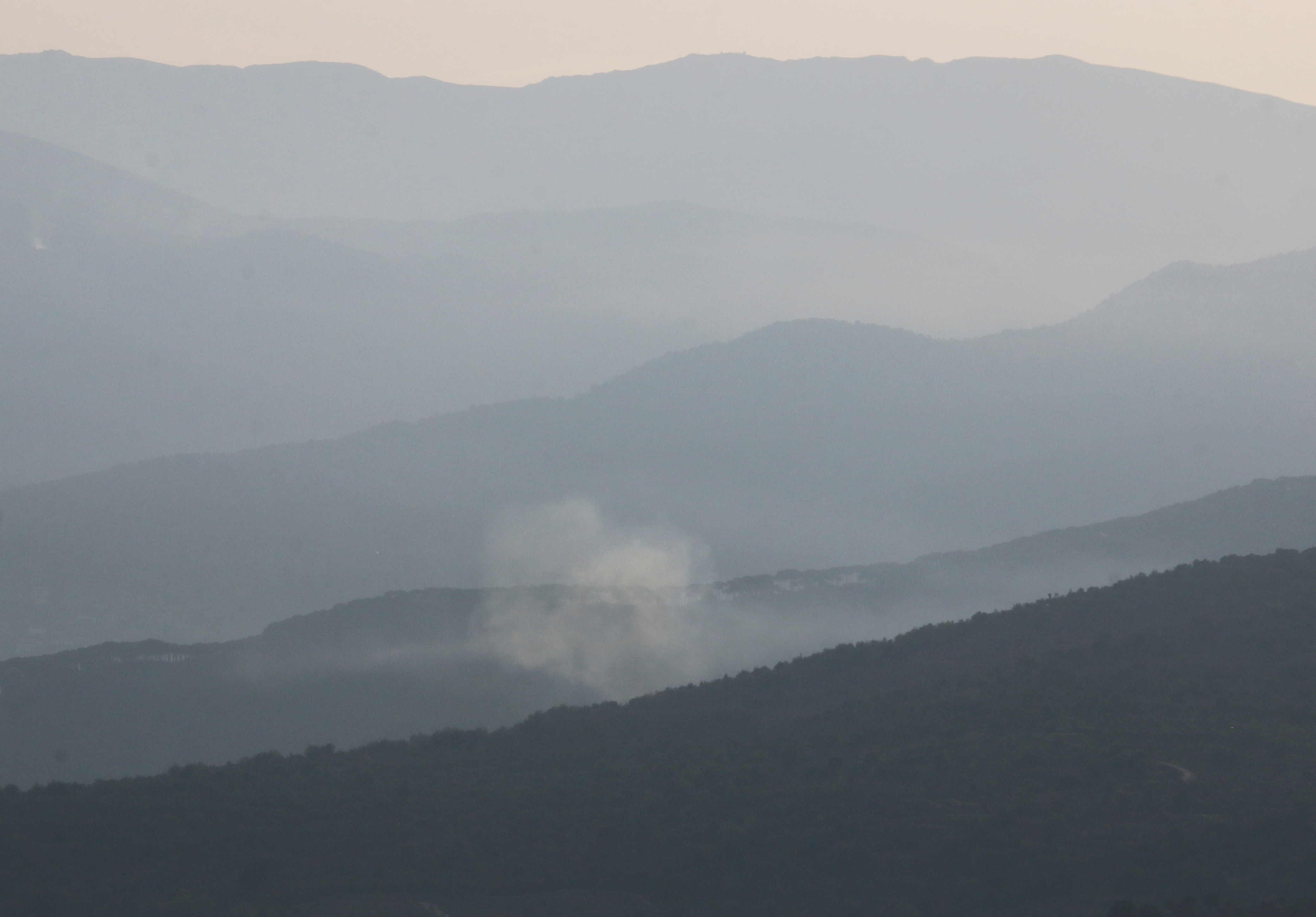 Smoke rises from the Shebaa farms area as seen from the Lebanese village of Rashaya al-Foukhar, in southern Lebanon, on October 8, 2023.