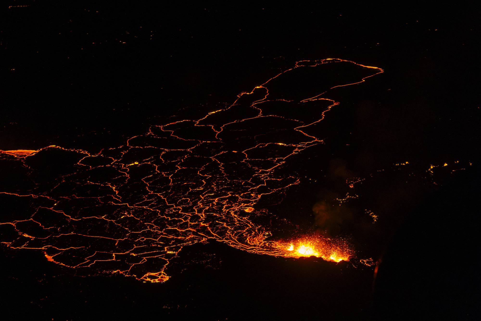 Molten lava is seen exiting a fissure on the Reykjanes peninsula on Tuesday.