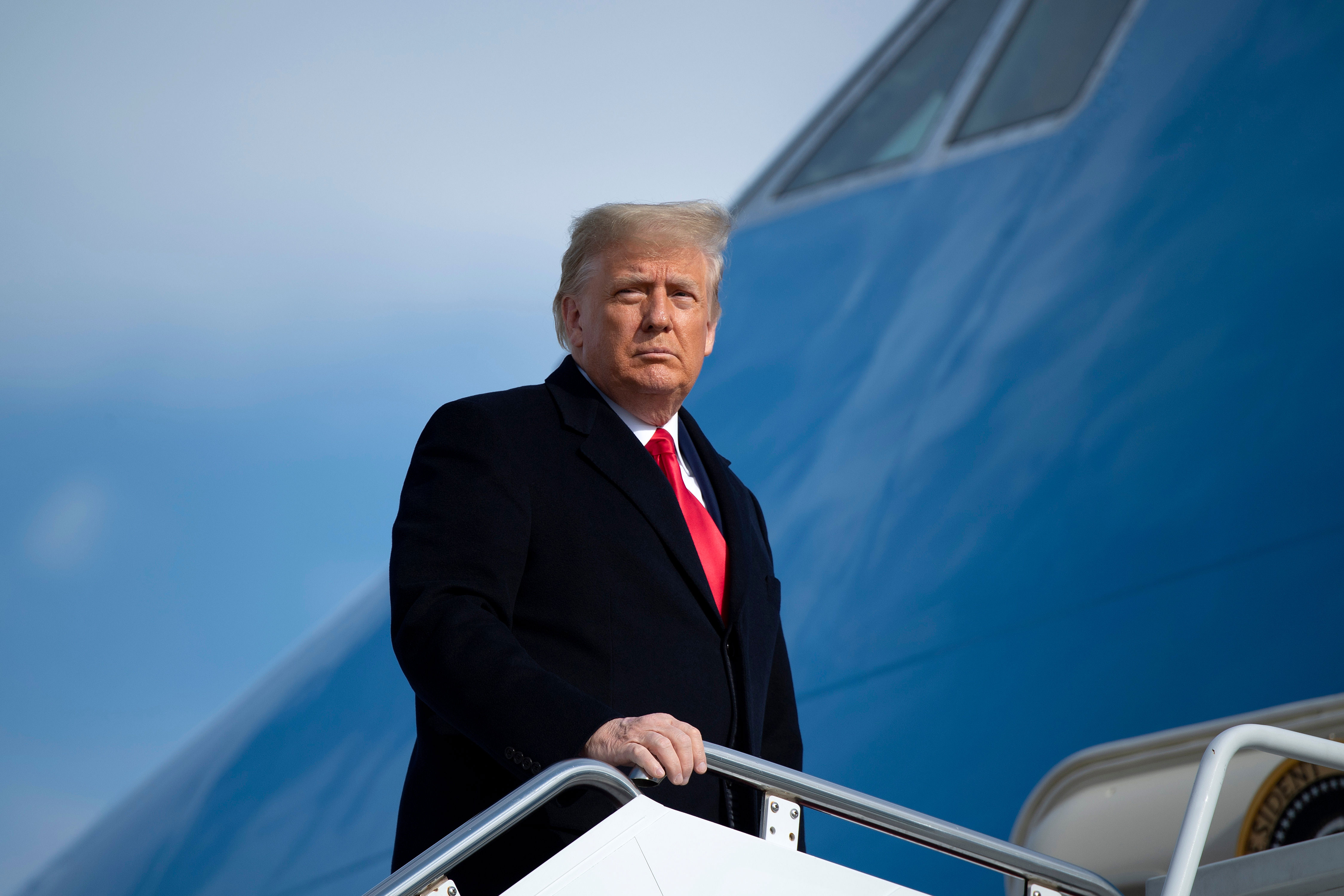 President Donald Trump boards Air Force One on December 12 at Joint Base Andrews in Maryland.