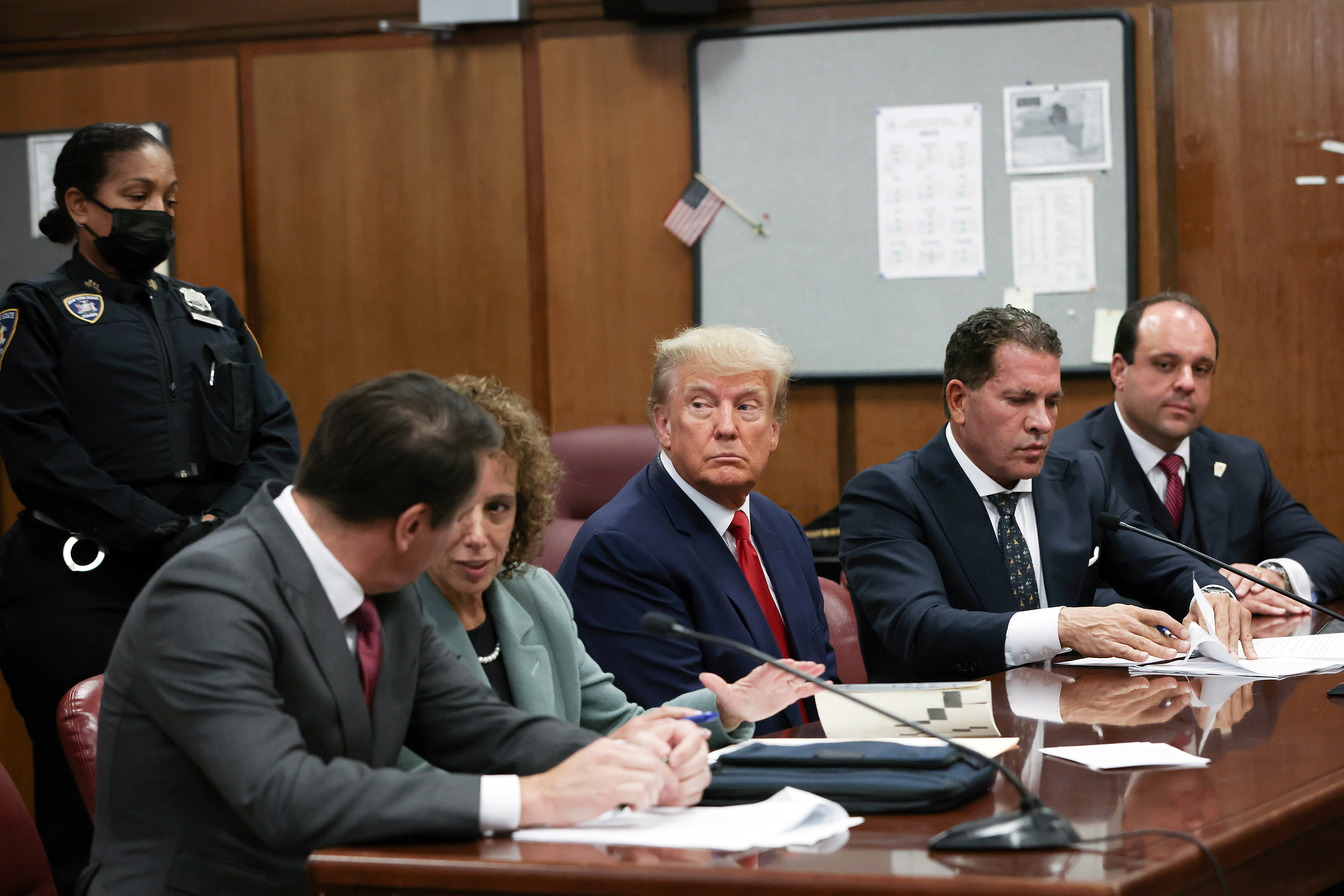 Former President Donald Trump sits in the courtroom with his attorneys Todd Blanche, Susan Necheles, Joe Tacopina and Boris Epshteyn during his arraignment at the Manhattan Criminal Court April 4, in New York City.