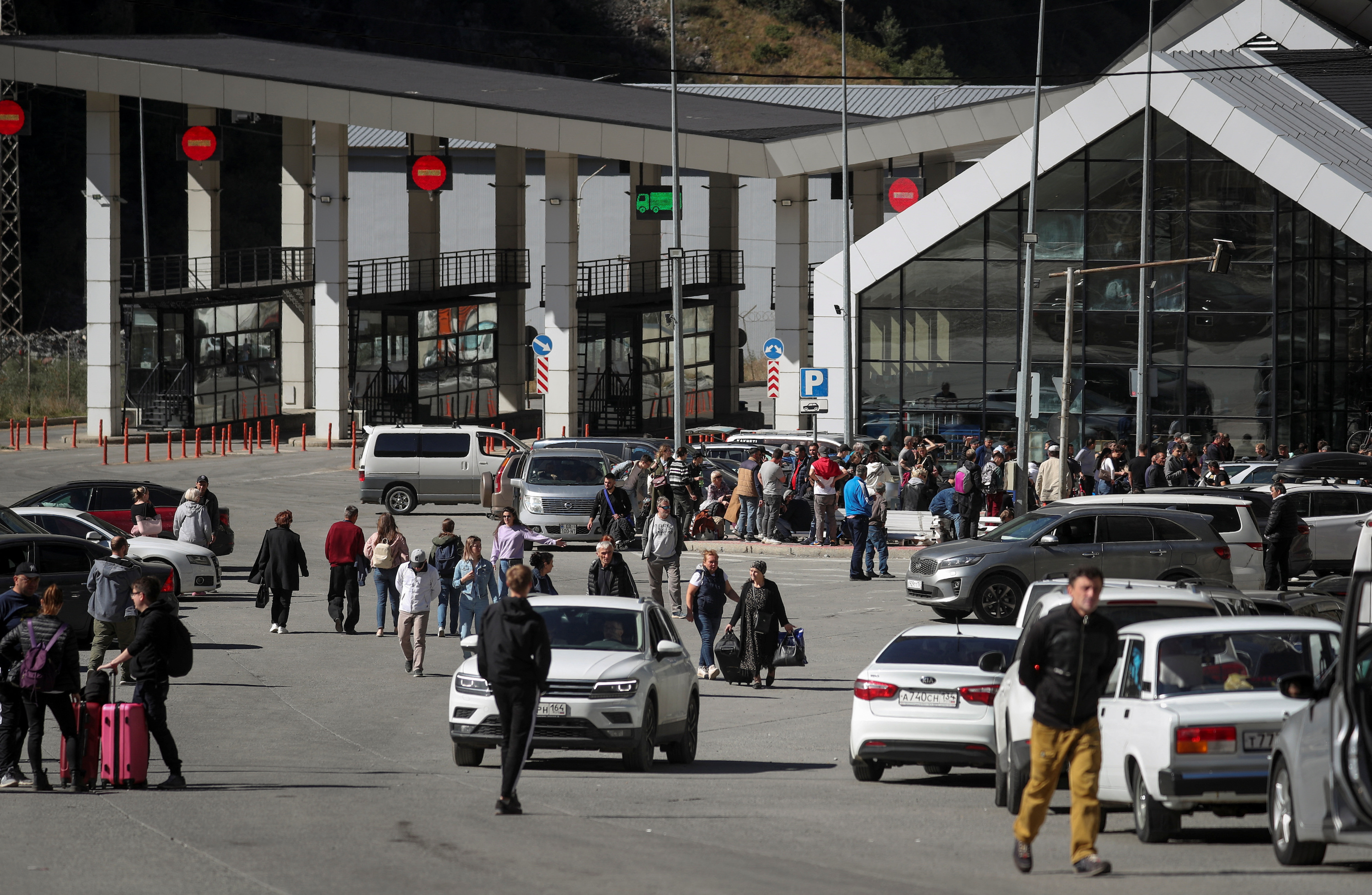 Travelers from Russia cross the border to Georgia at the Verkhnii Lars checkpoint on September 26.