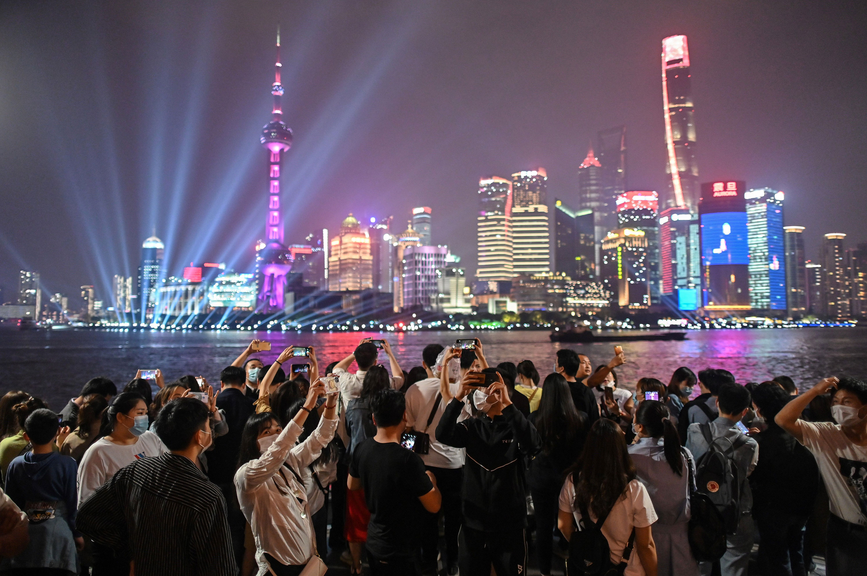 People gather along the Huangpu River for May Day in Shanghai, China, on May 1.