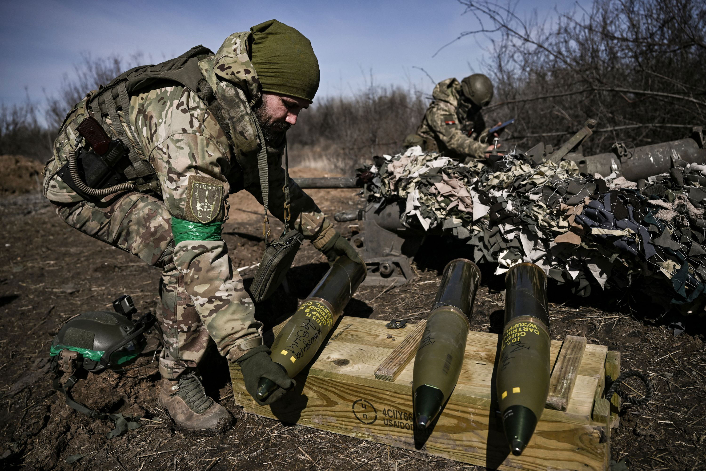 A Ukrainian serviceman prepares a 105 shell to fire at Russian positions near Bakhmut on March 14. 