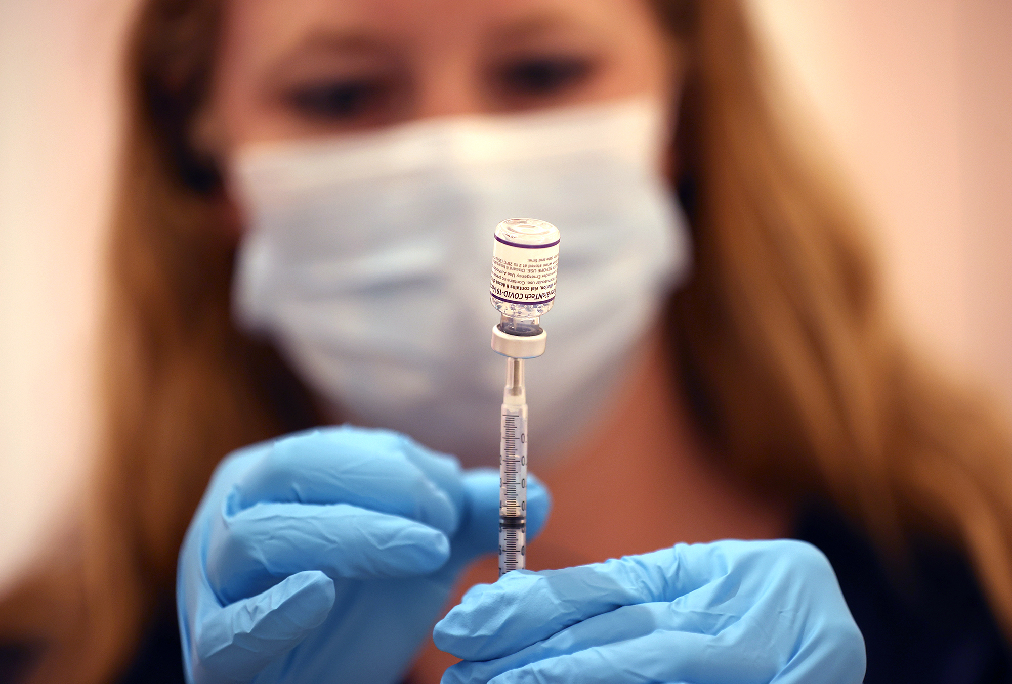 A pharmacist fills a syringe with the Pfizer Covid-19 vaccine on Oct. 1 in San Rafael, California. 