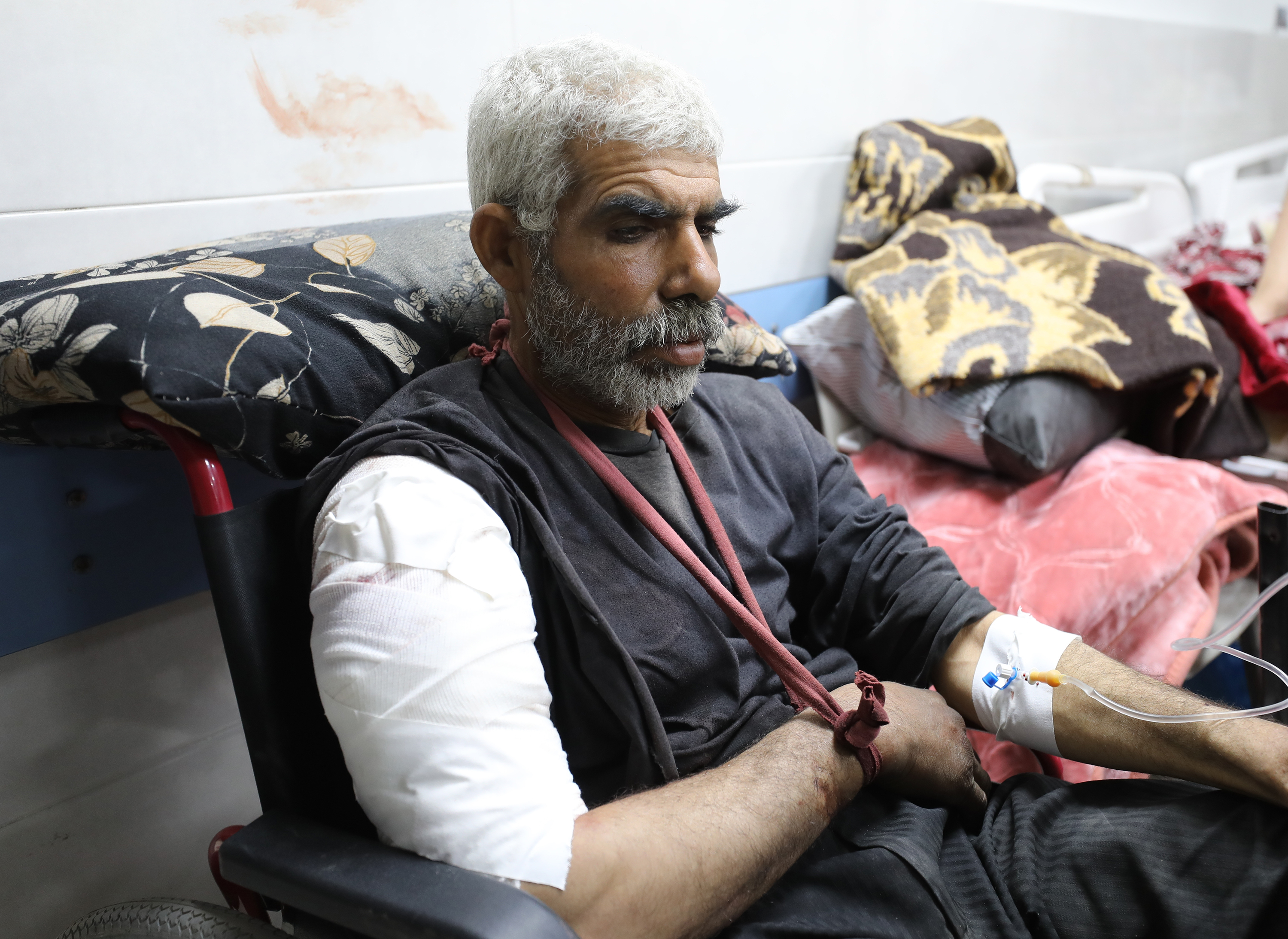 A wounded Palestinian receives medical treatment at Al-Shifa Hospital after Israeli forces opened fire on Palestinians waiting for humanitarian aid trucks on Al-Rashid Street in Gaza City, Gaza, on February 29.