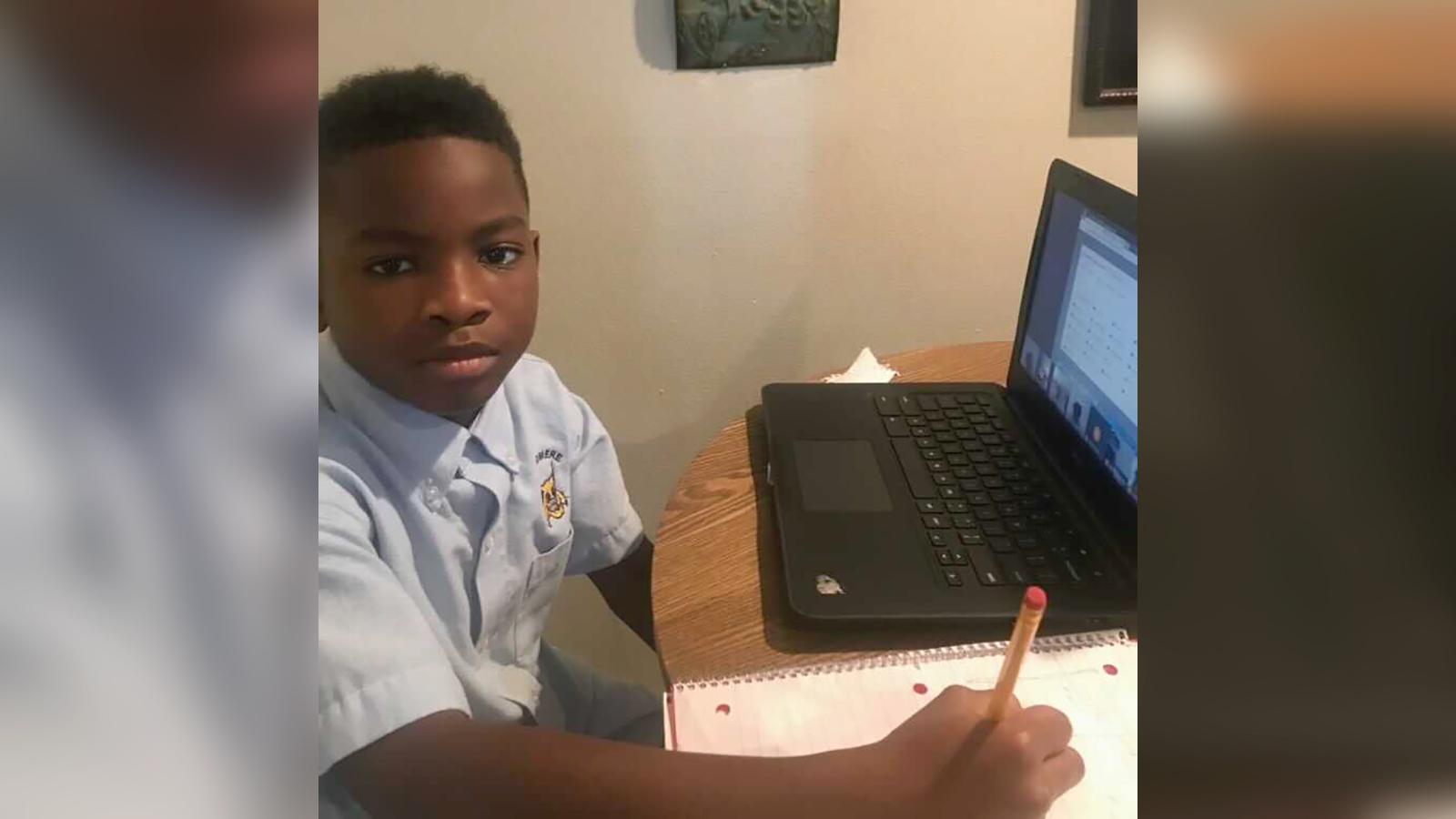 Ka Mauri Harrison, 9, pictured in his home participating in virtual learning. 