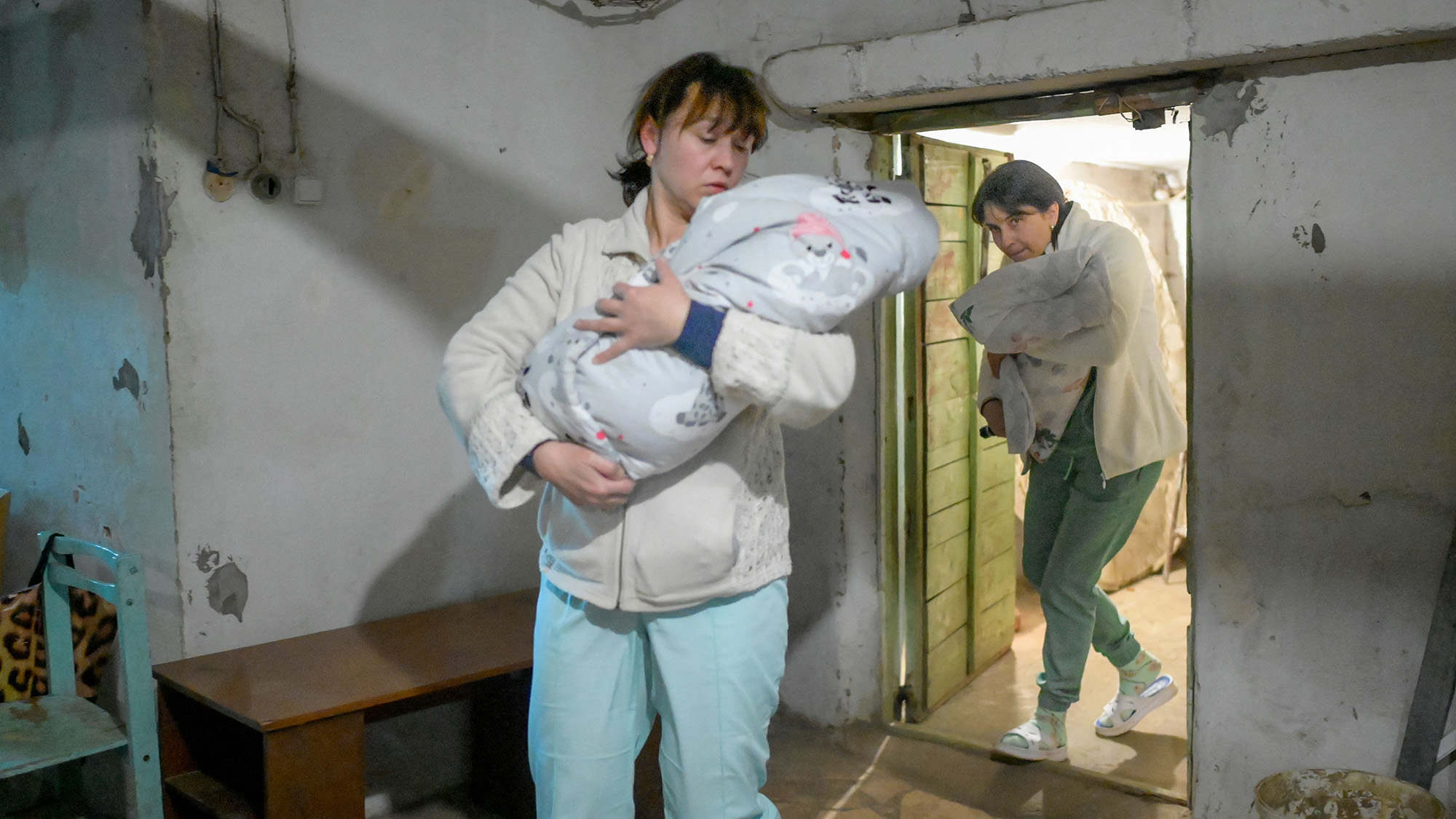 Nurses carry babies to the basement of a maternity hospital as sirens warn of a possible air raid in Mykolaiv, Ukraine on March 14.