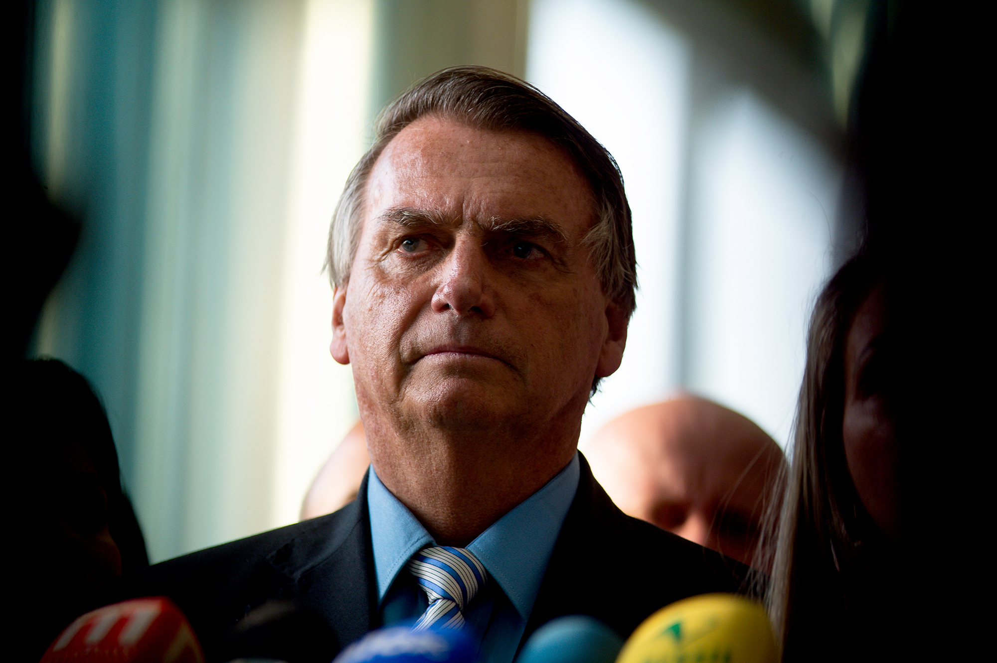 Jair Bolsonaro looks on during a press conference after meeting with mayors from all over Brazil at Alvorada Palace on October 19, in Brasilia, Brazil.